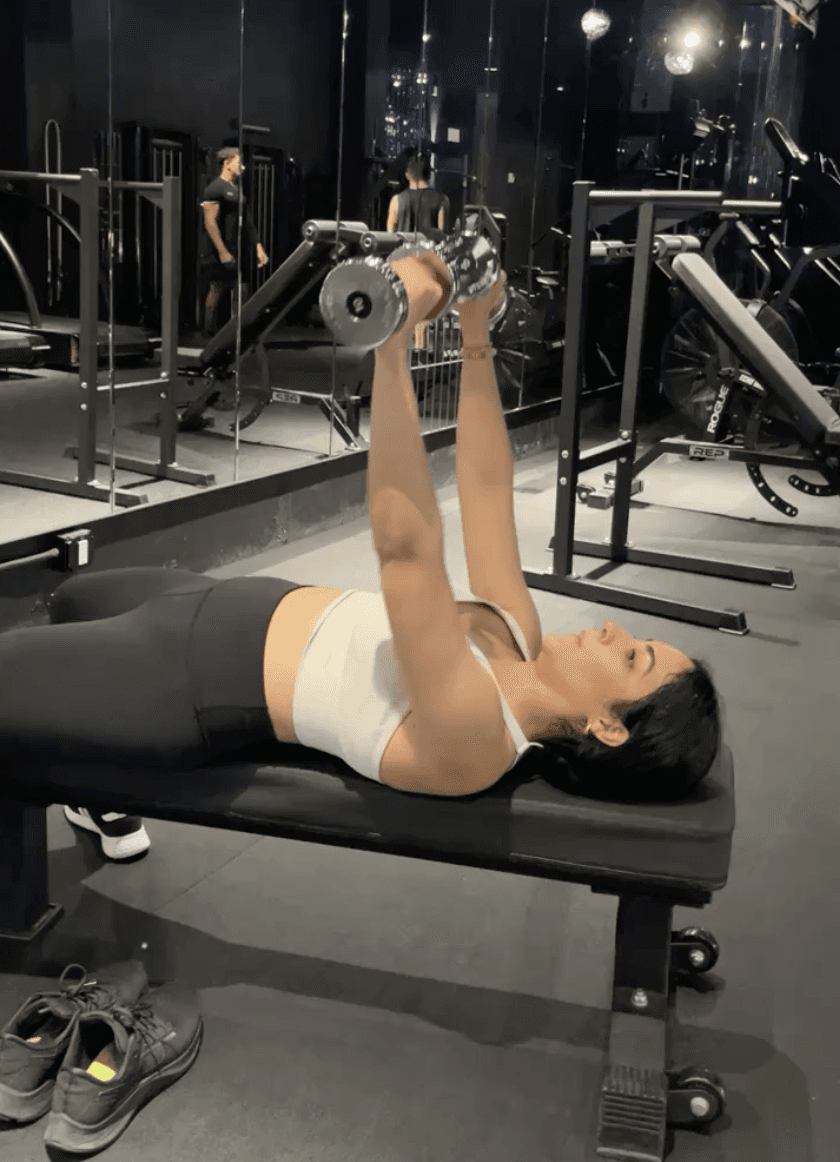 Fat loss client doing dumbbell chest press