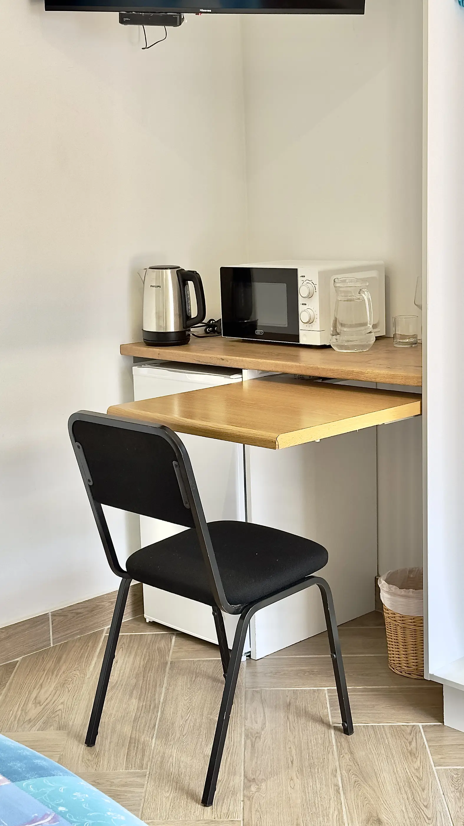 The workspace desk and honesty bar fridge in our Escape to 8 room.