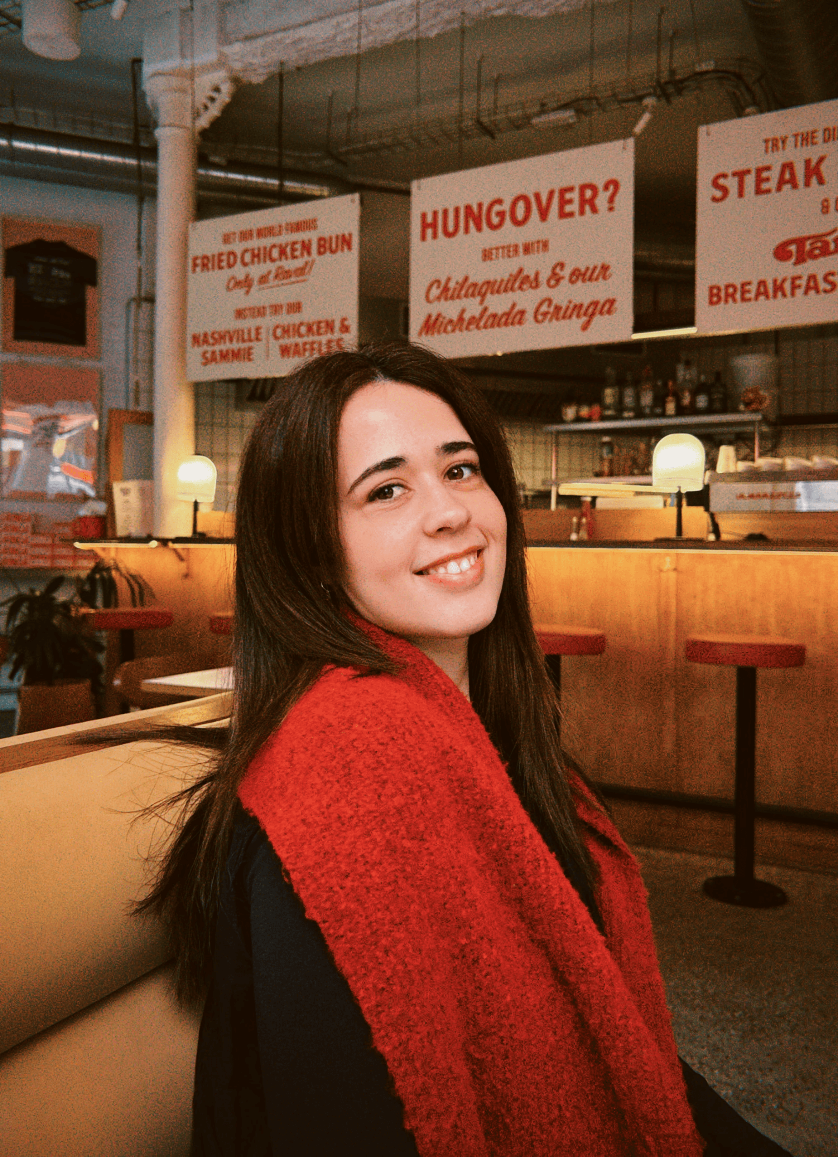 Monochrome product shot: black-capped cosmetic bottle with dynamic water splash on a clean white background.