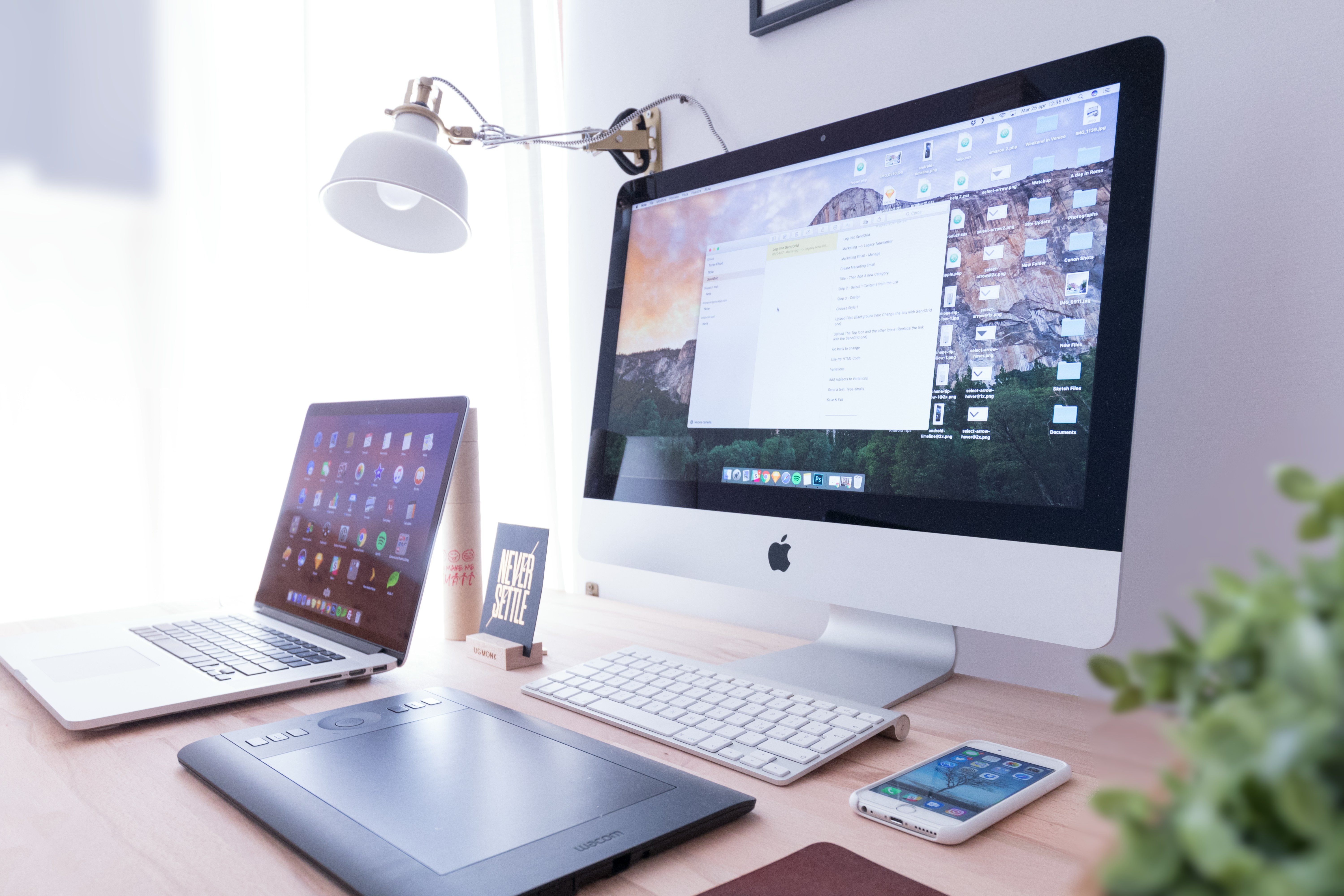 A working desk with some devices turned on.