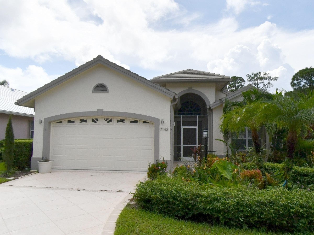 1995 New Roof Construction in Hawks View, PGA Village, Port St Lucie with Entegra Flat Broomswept Tile in Natural Gray