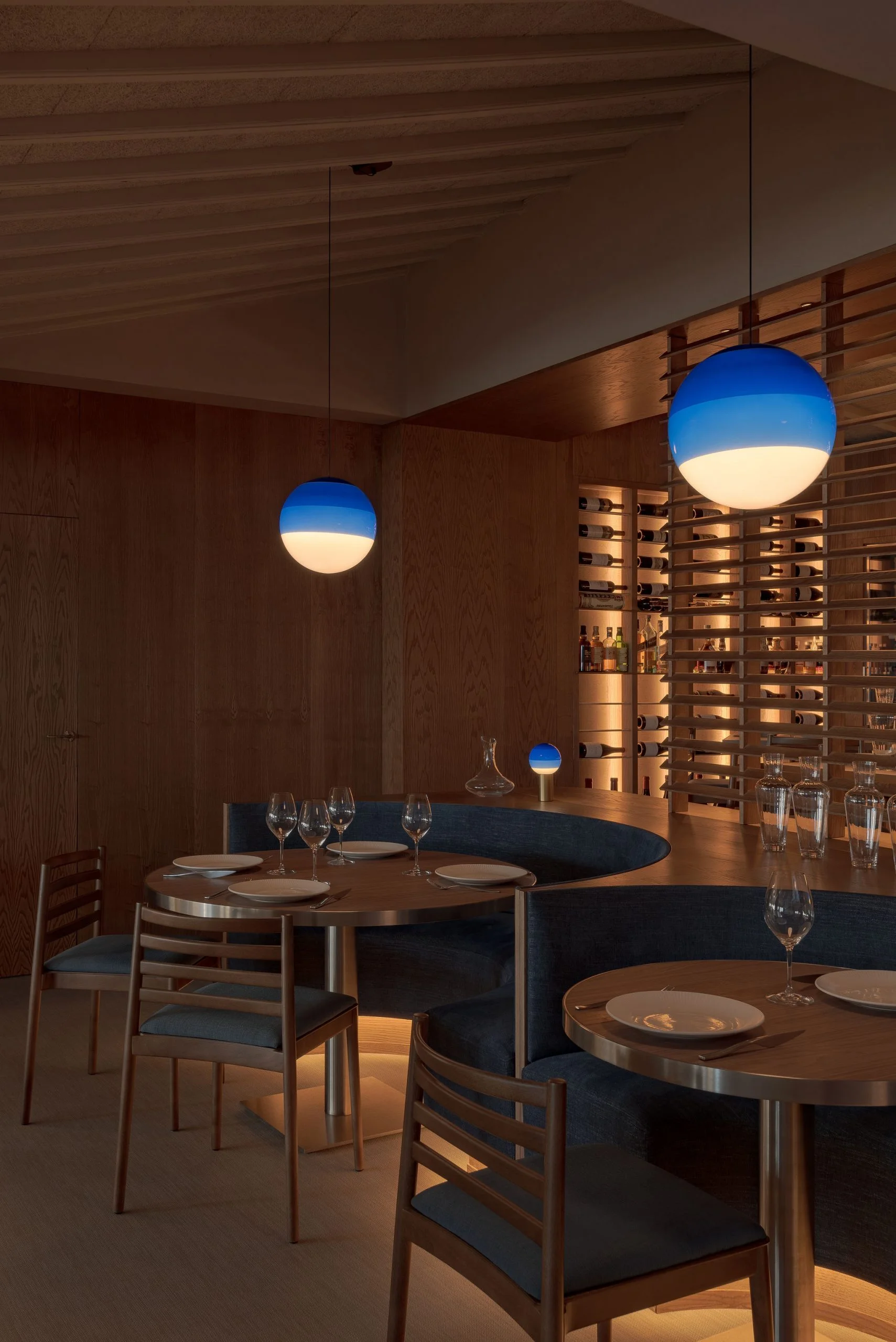 A vintage race car with blue, orange, and white livery