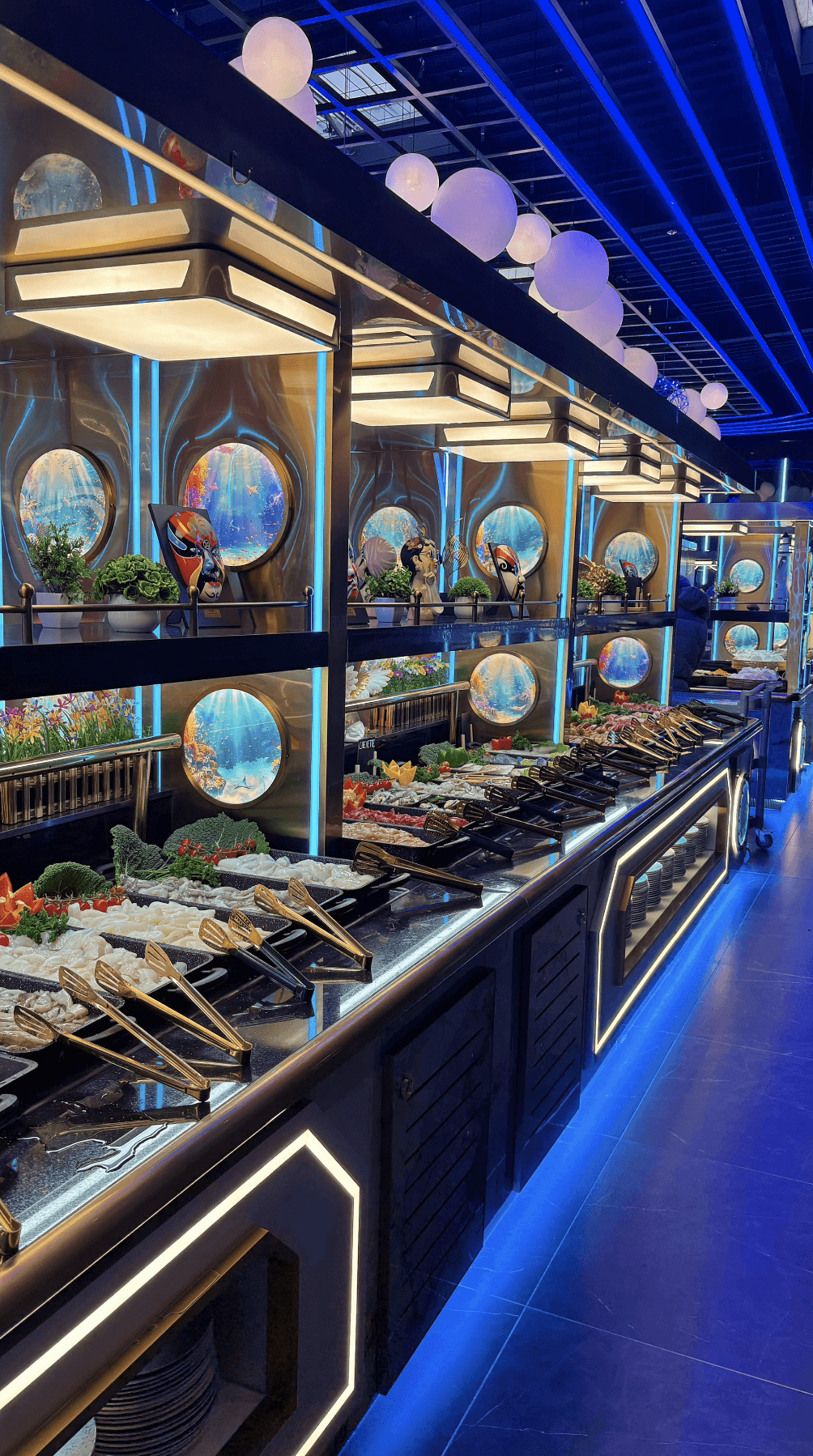 a glass of cocktail with a slime orange fruit