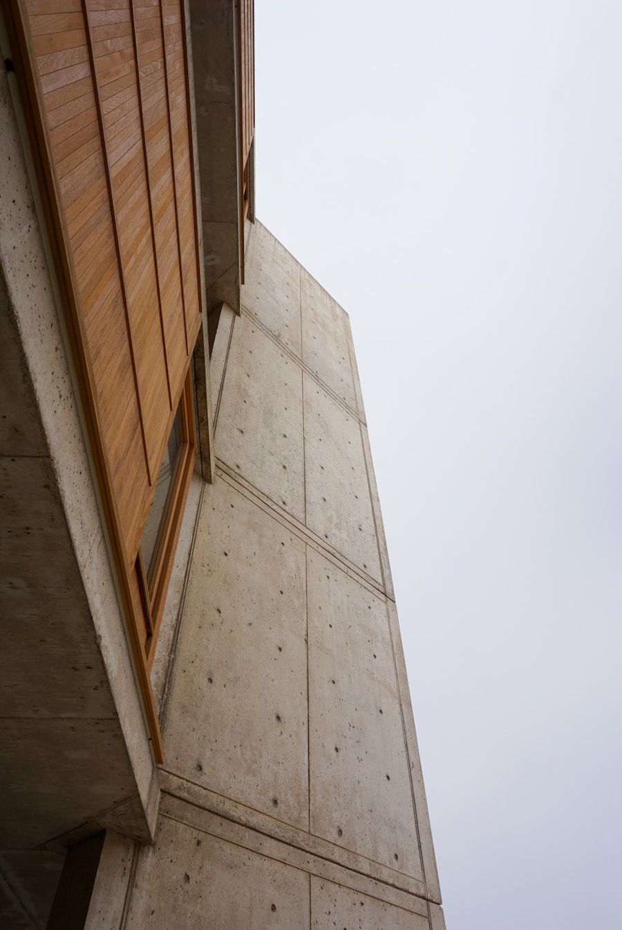 Timber cladding folded into a precast concrete facade