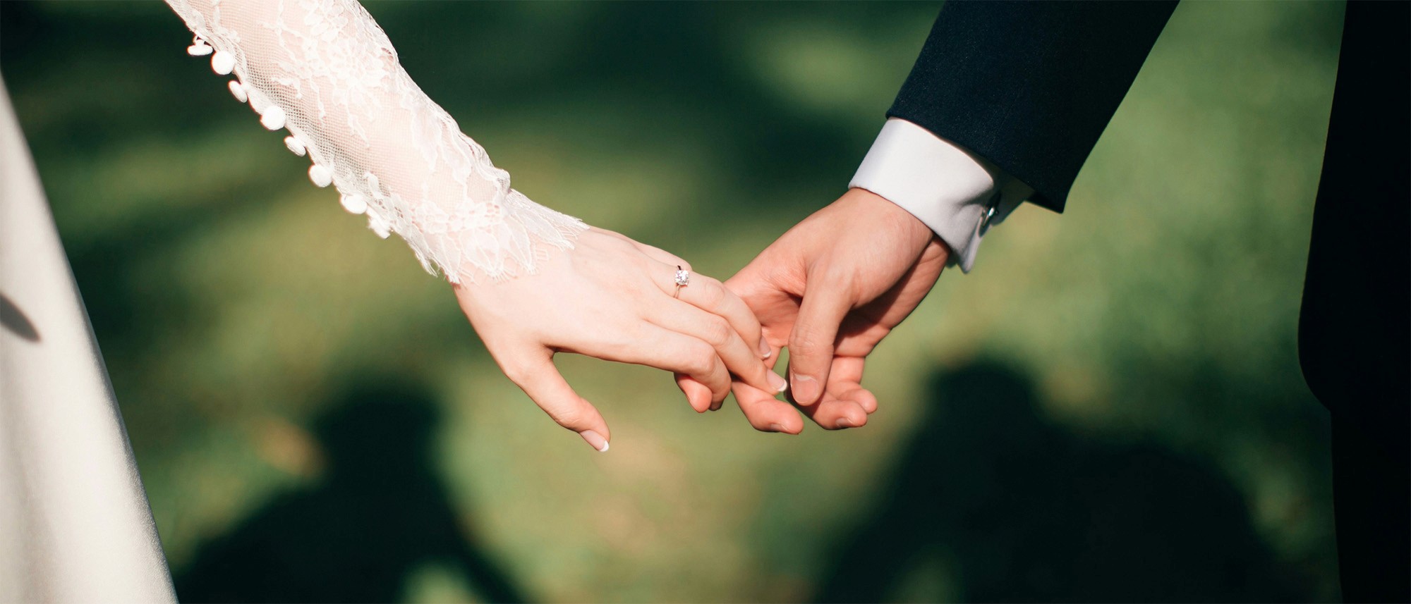 man and woman holding hands focus photo