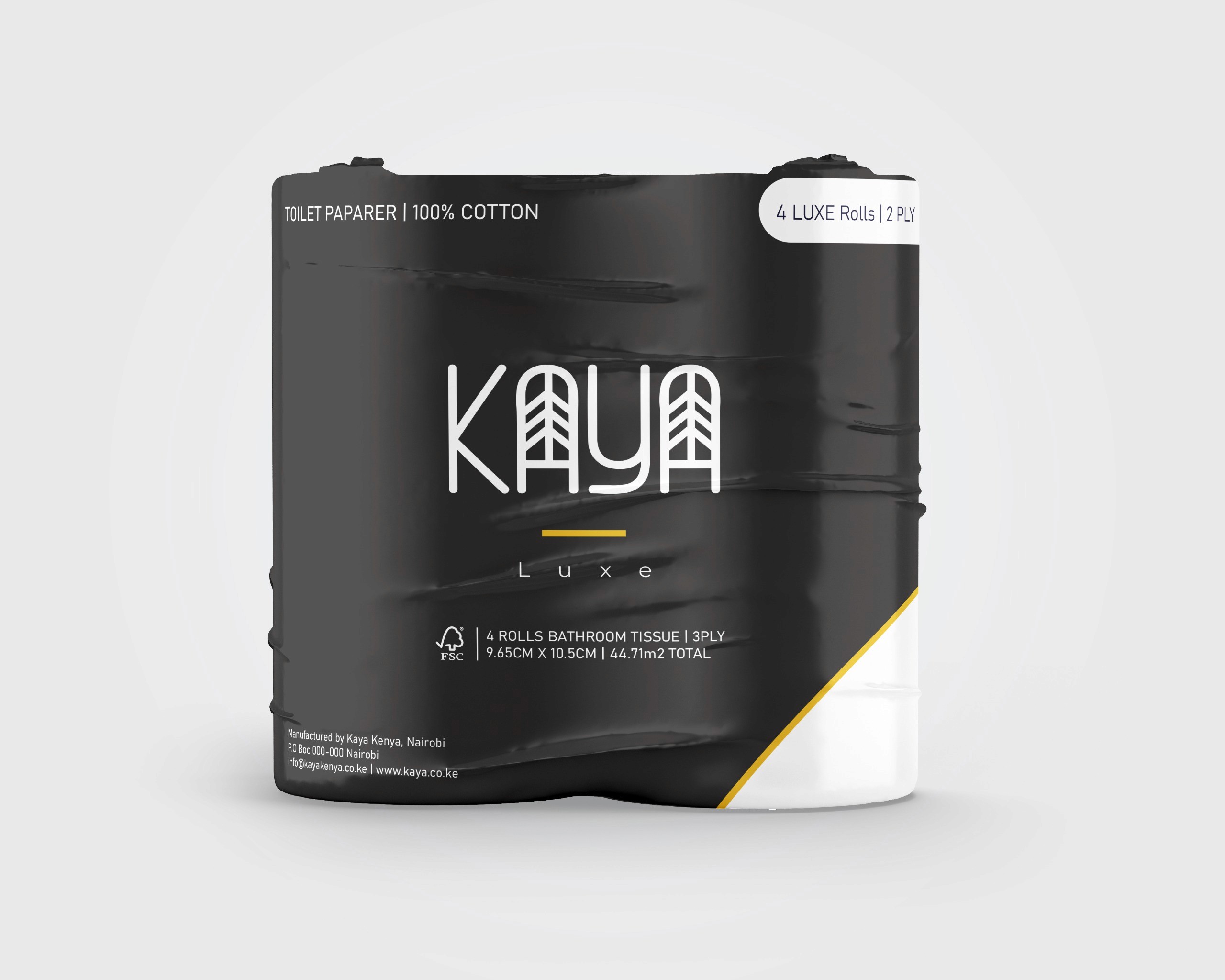 A person in a white outfit sits on a round stool in a spacious, minimalist room. The wall is covered with framed photos surrounding a large screen, creating a serene, contemplative atmosphere