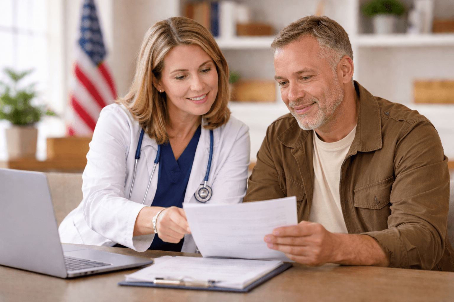 two people looking at a tablet and smiling