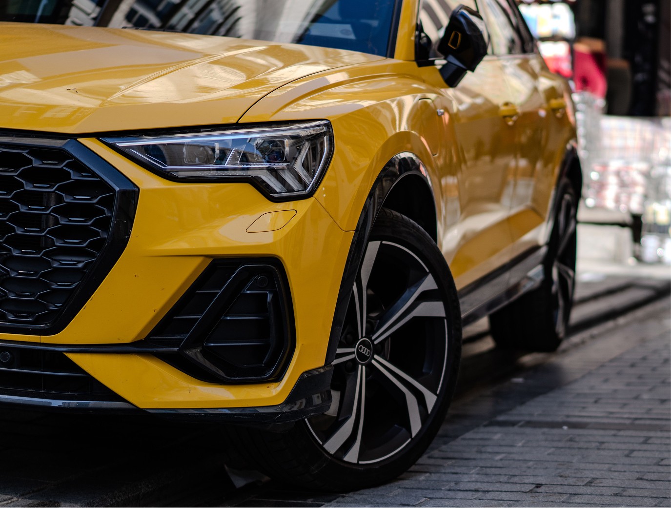 Yellow Audi SUV parked and detailed