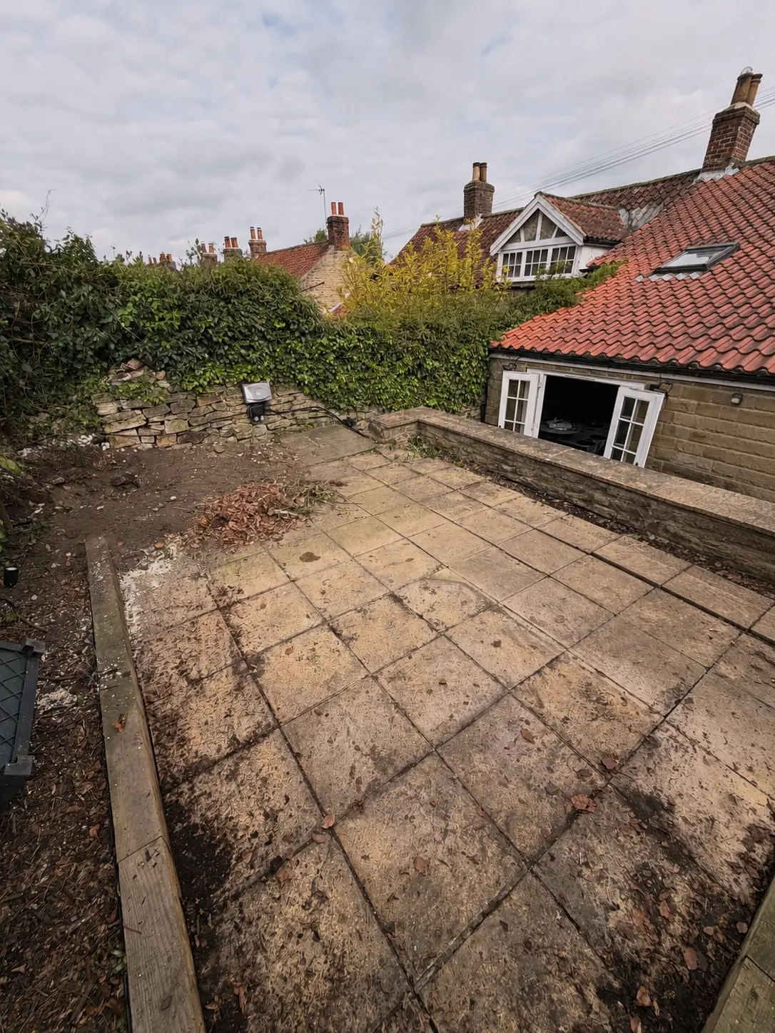 Existing paved garden area before the Airbnb landscaping work in York