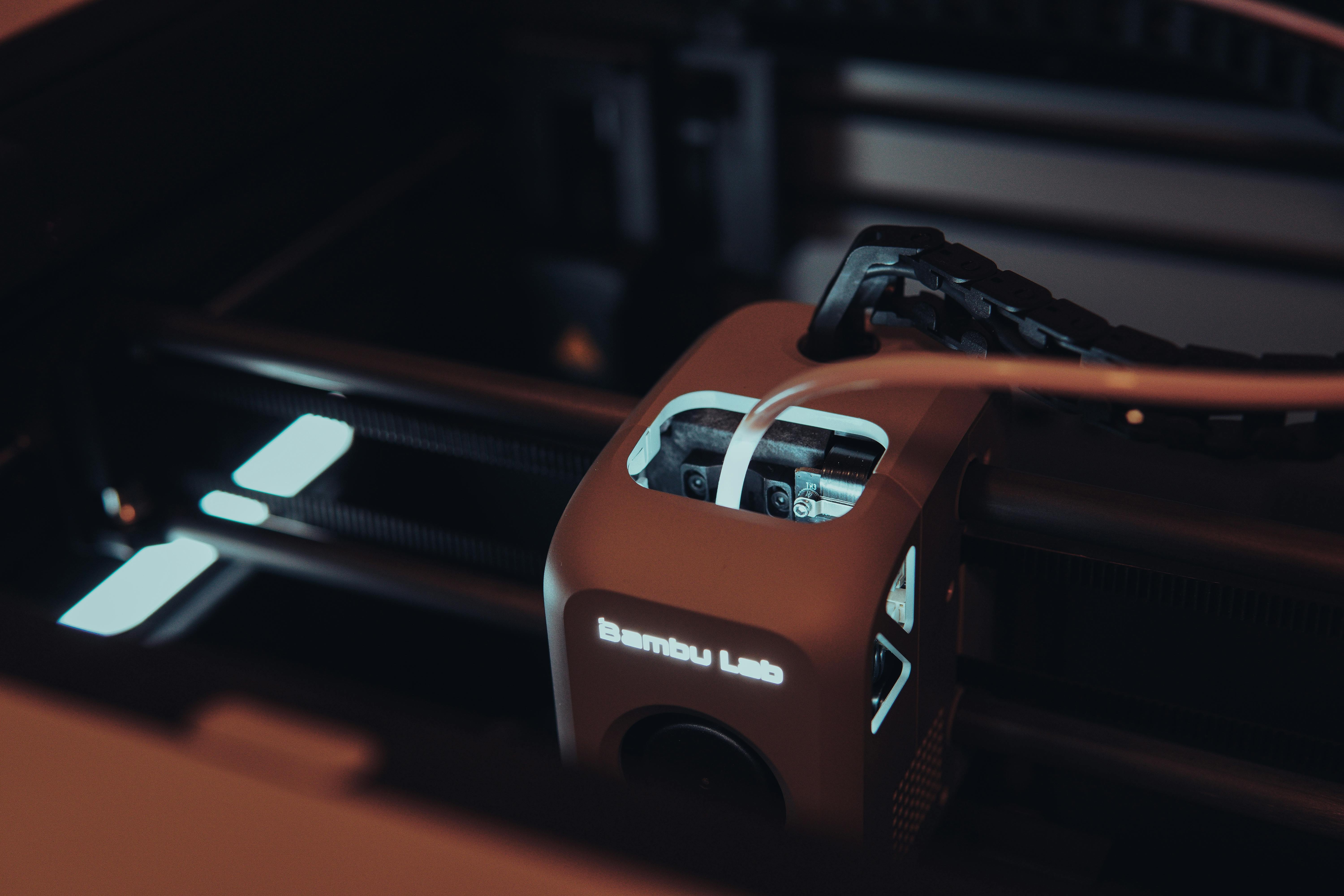 Close-up of a 3D printer head in operation