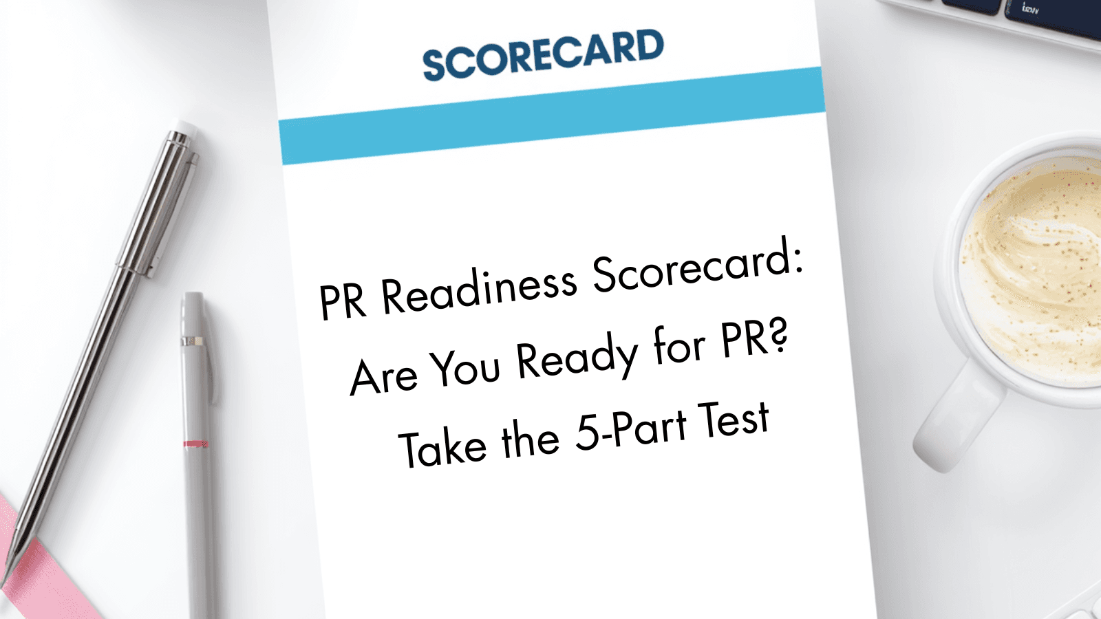A white scorecard on a desk beside pens and a cup of coffee displays the title “PR Readiness Scorecard: Are You Ready for PR? Take the 5-Part Test.”