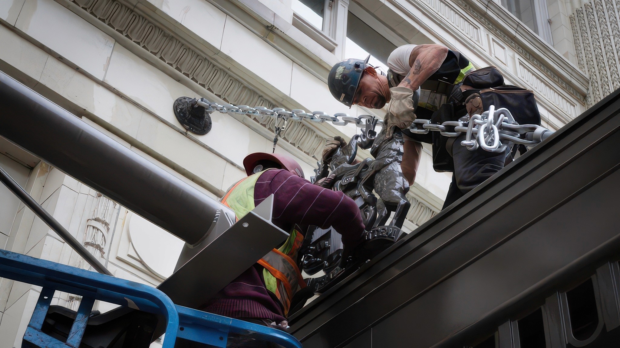 Photo of a man welding metal wearing protective gear