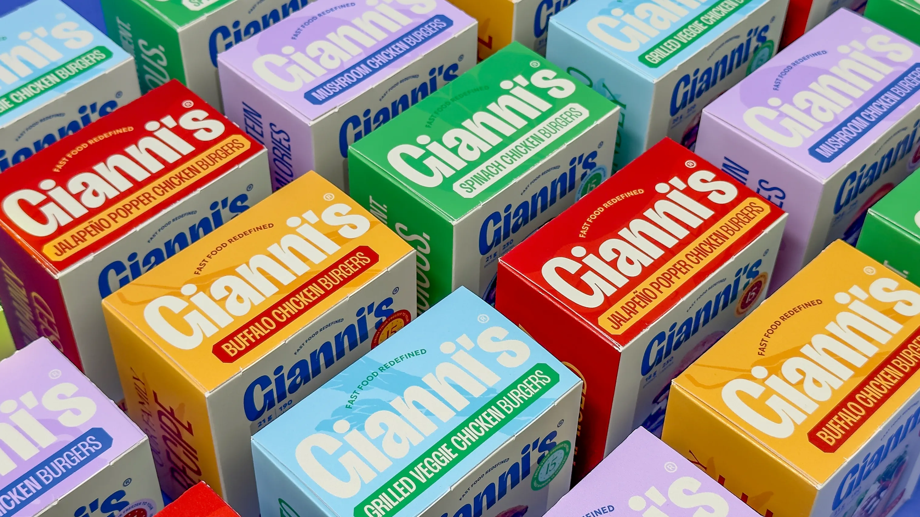 Gianni’s chicken burger packages arranged in a repeating grid of colorful varieties
