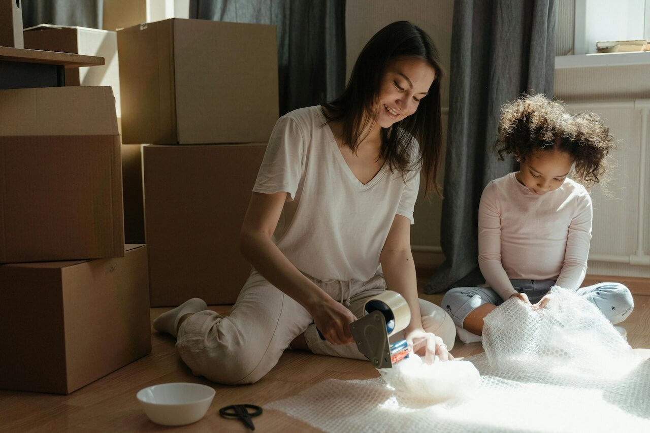 Mother and her child are packing together