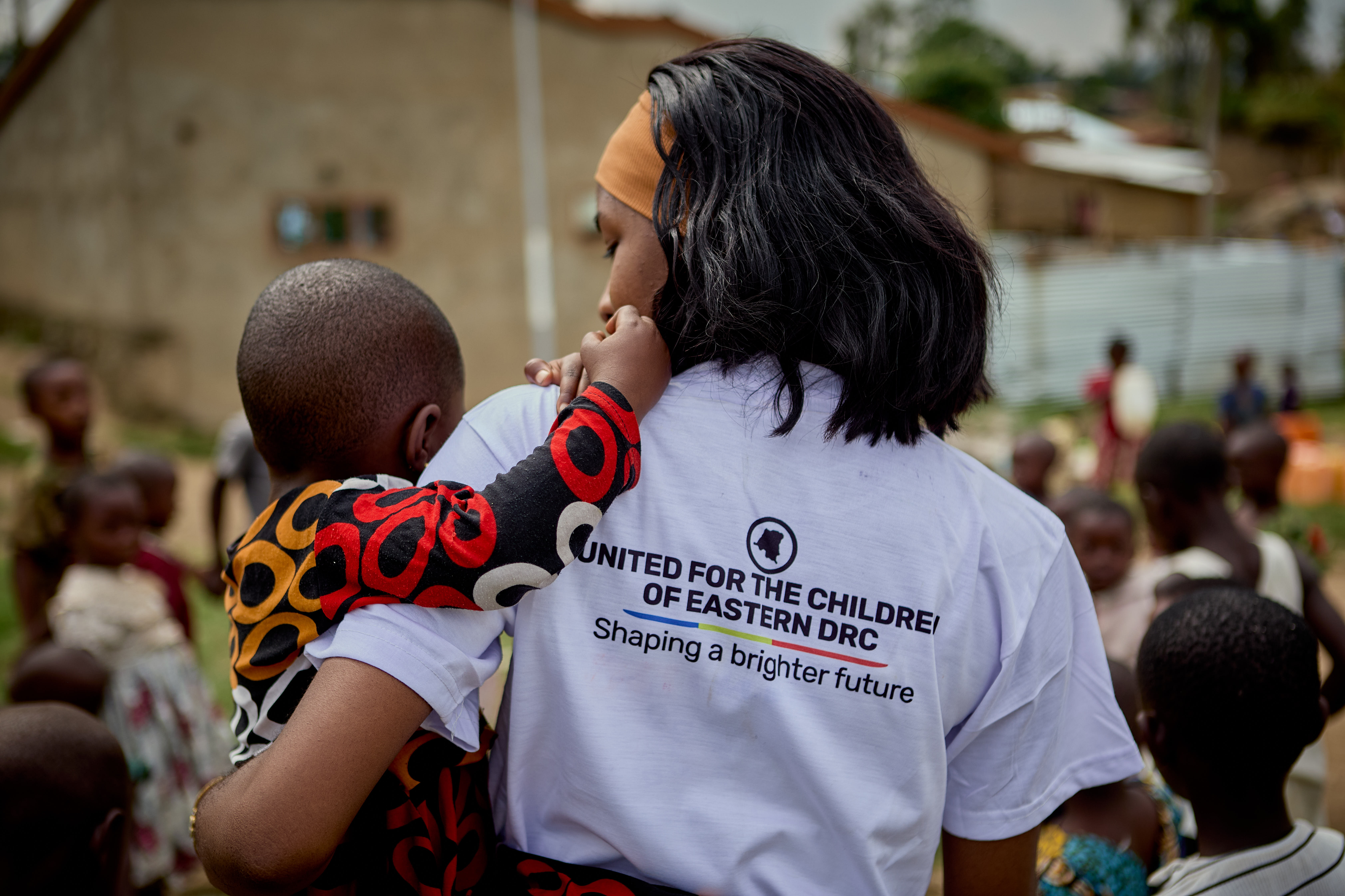 children sitting on chairs inside classroom