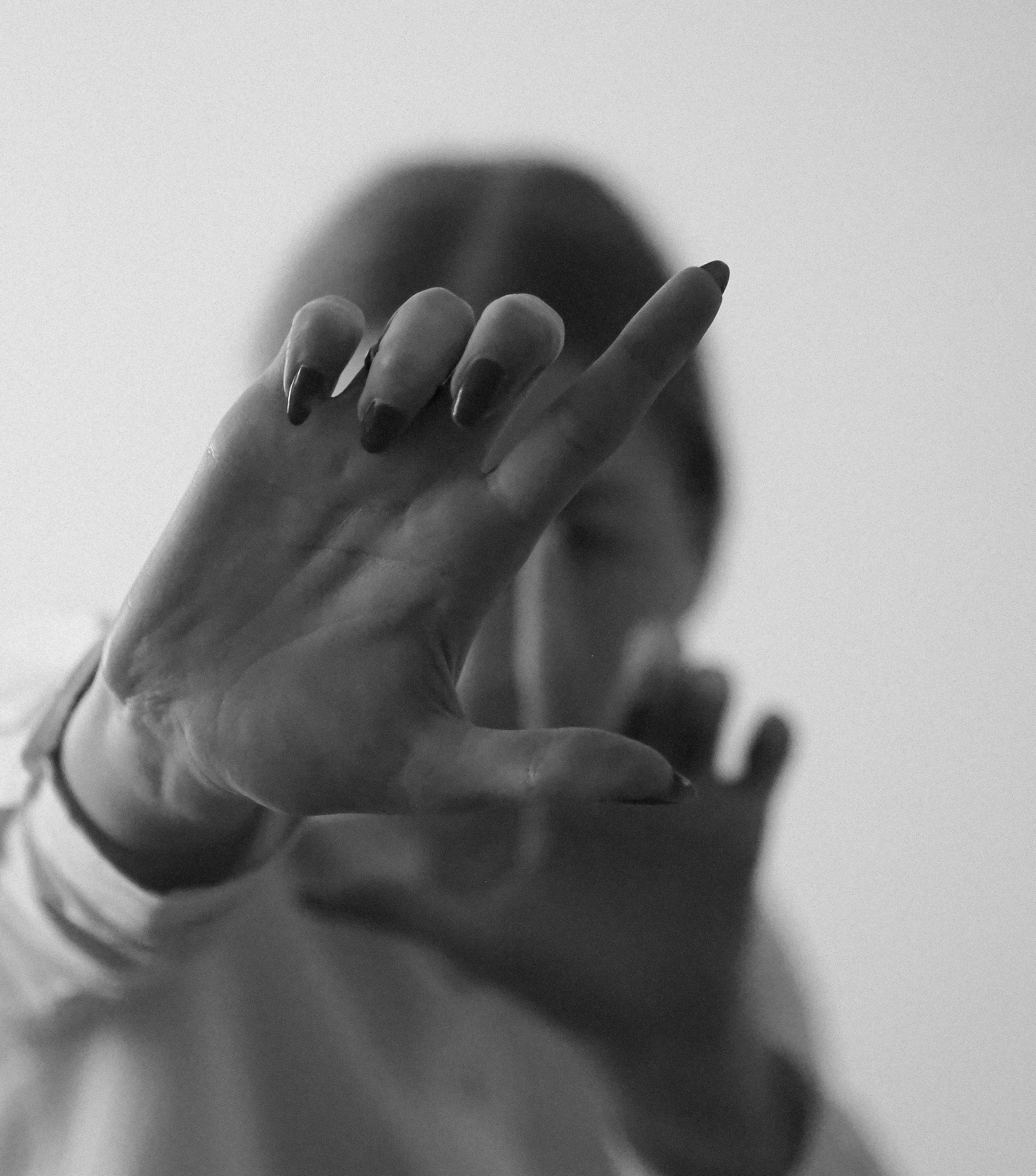Artistic Black and White Hand Gesture Portrait