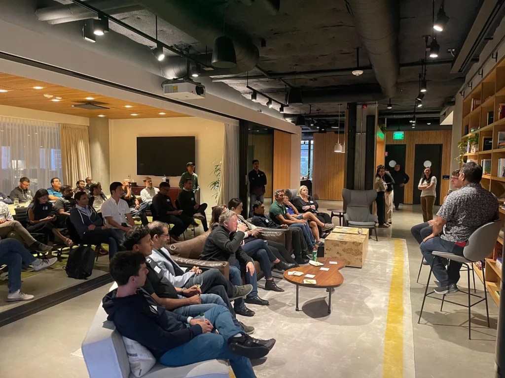 a group of people sitting at the enterprise founders dinner
