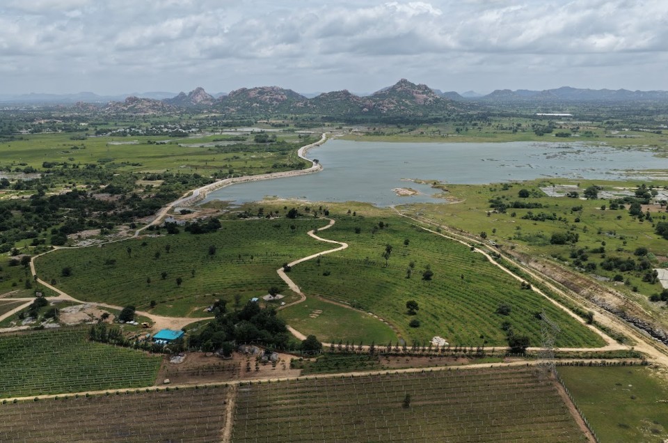 Aerial view of solar farms and cultivated fields