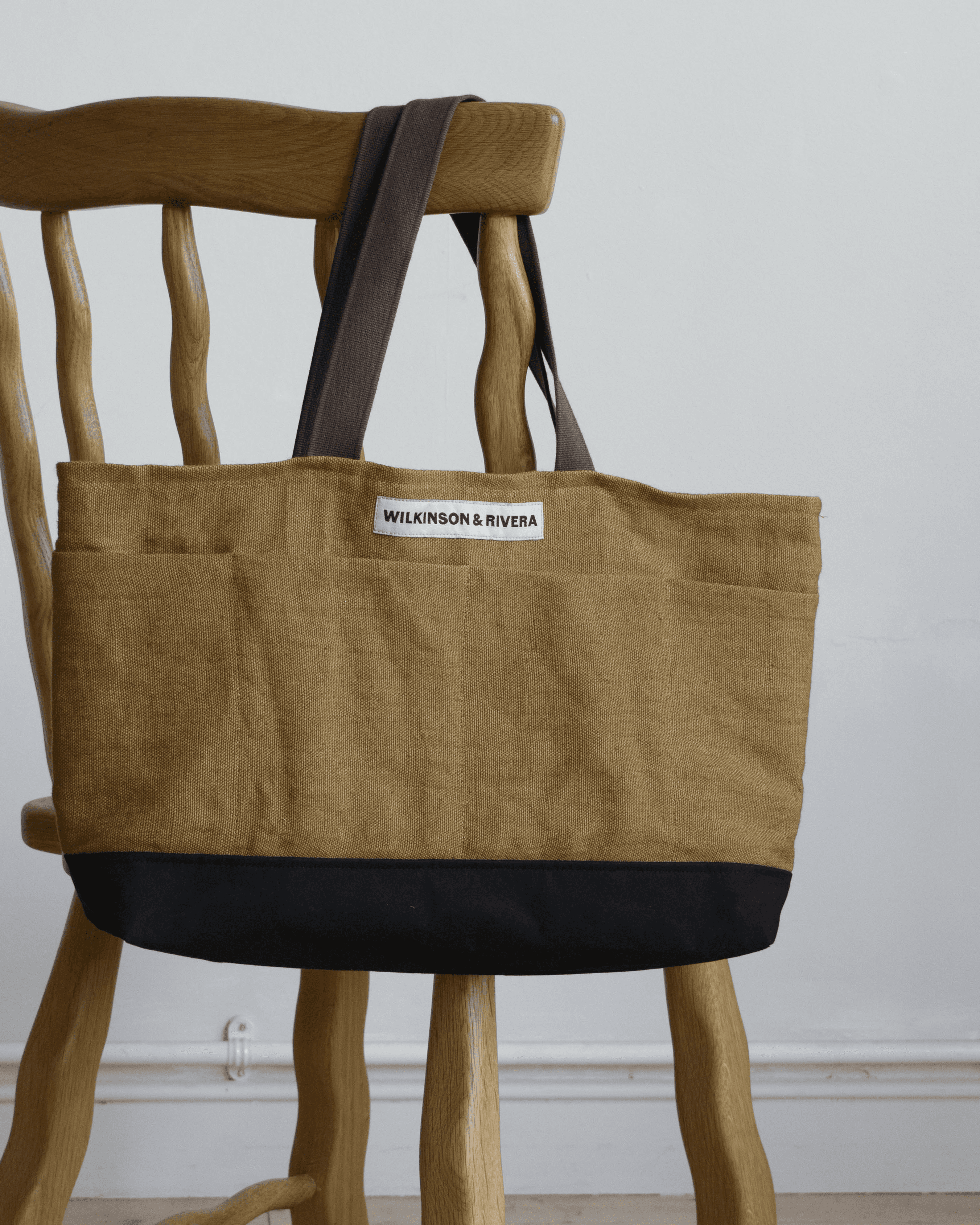 Limited edition Garden Tote from Wilkinson & Rivera in Belgian Linen hanging from chair