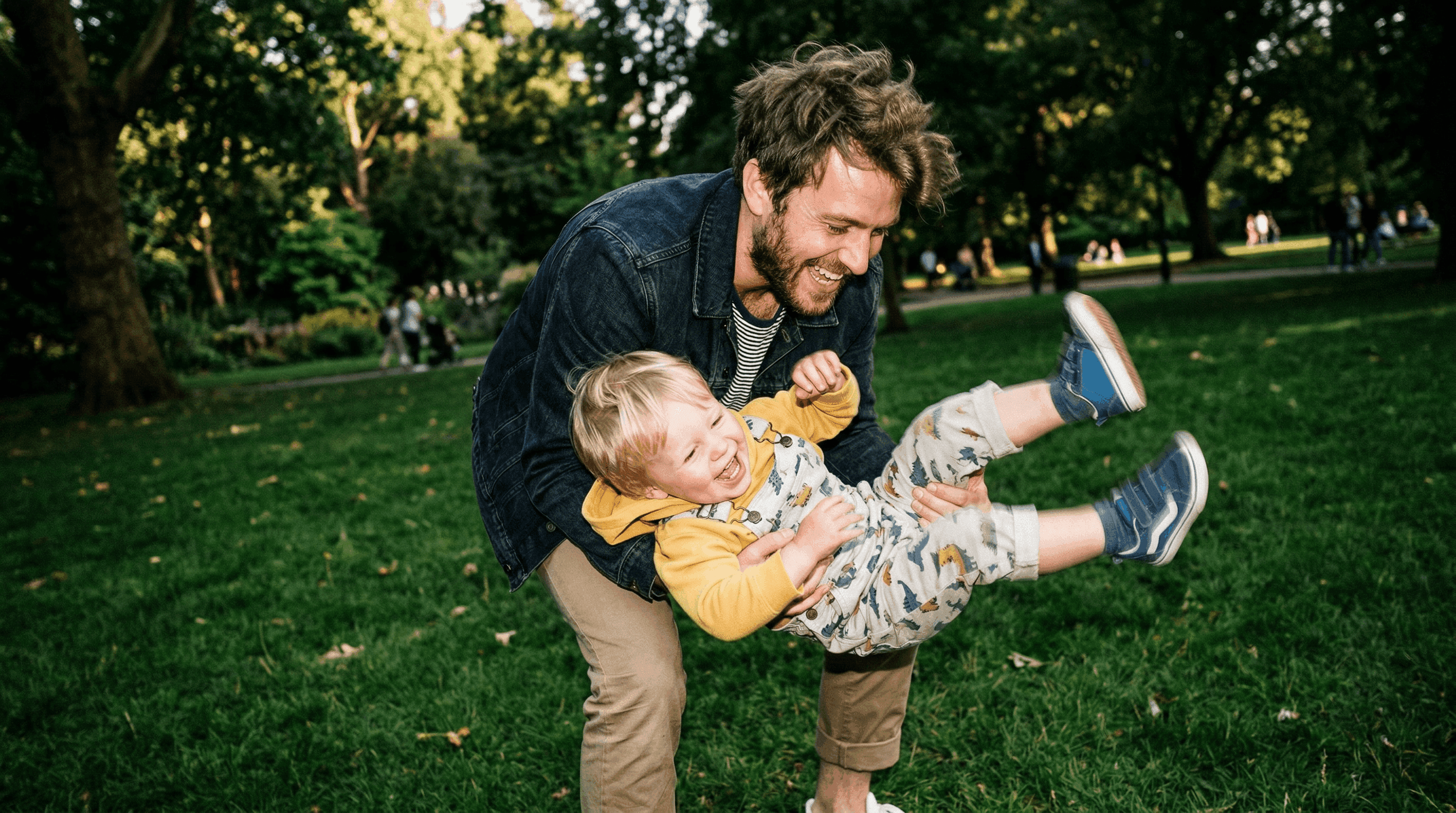 Father playing with his son in a park
