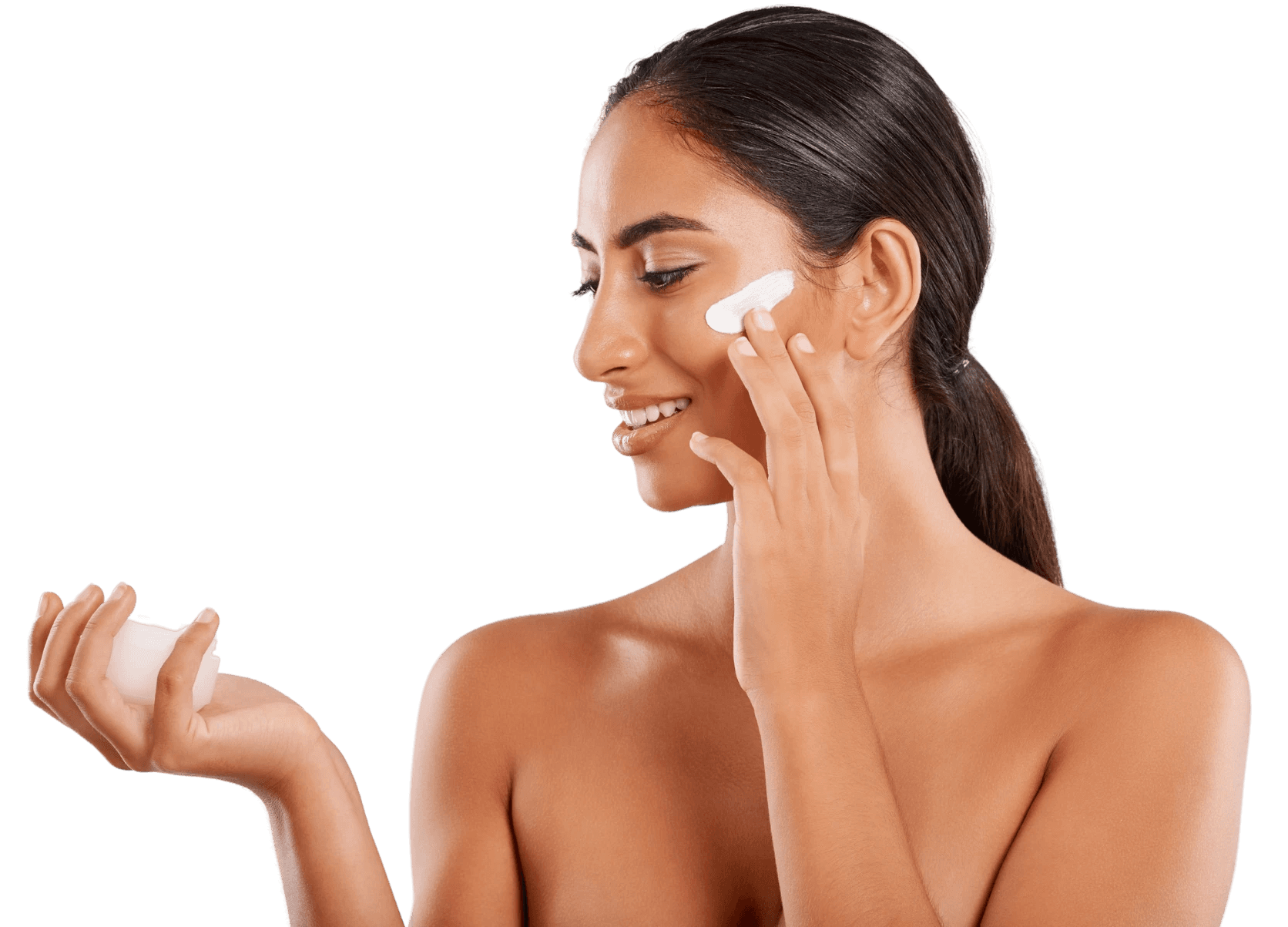 Beautiful woman applying lotion on her face