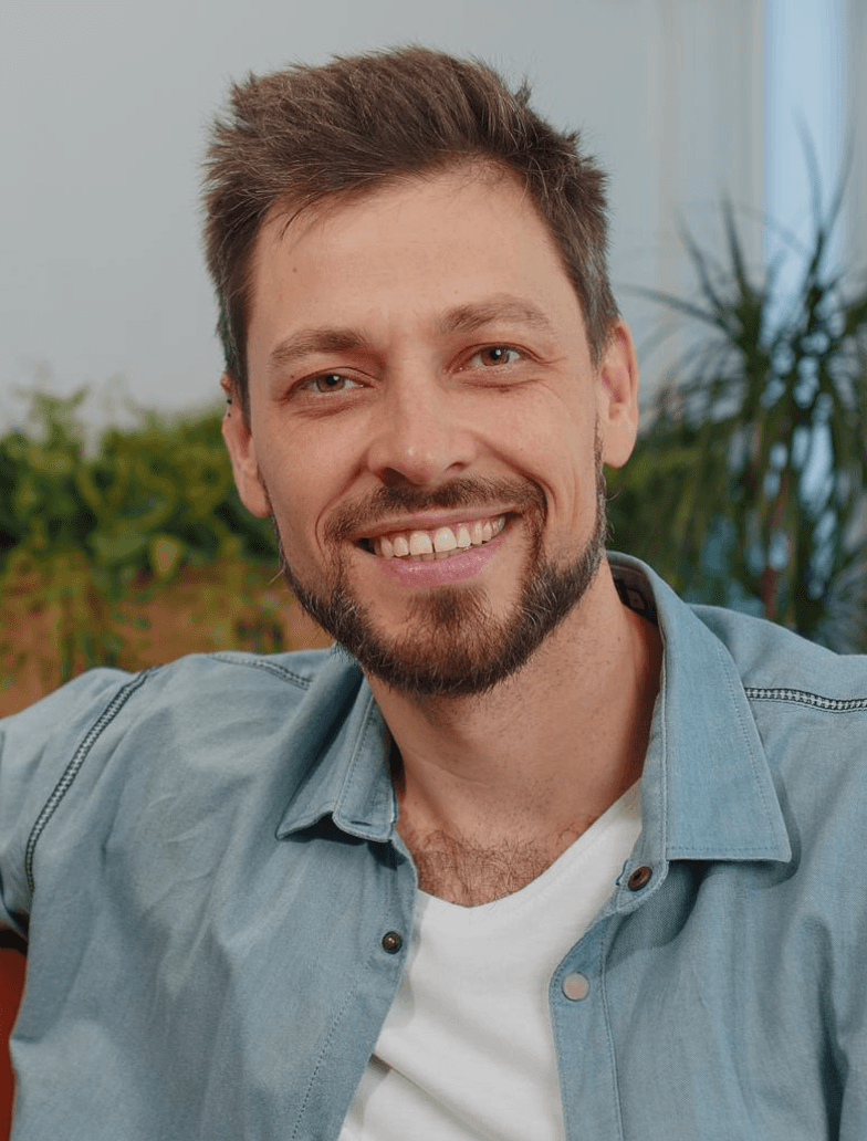 Smiling man in denim shirt, financial advisor, Key 2 Debt Free consultant