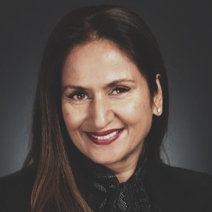 a man in a blue suit posing for a picture