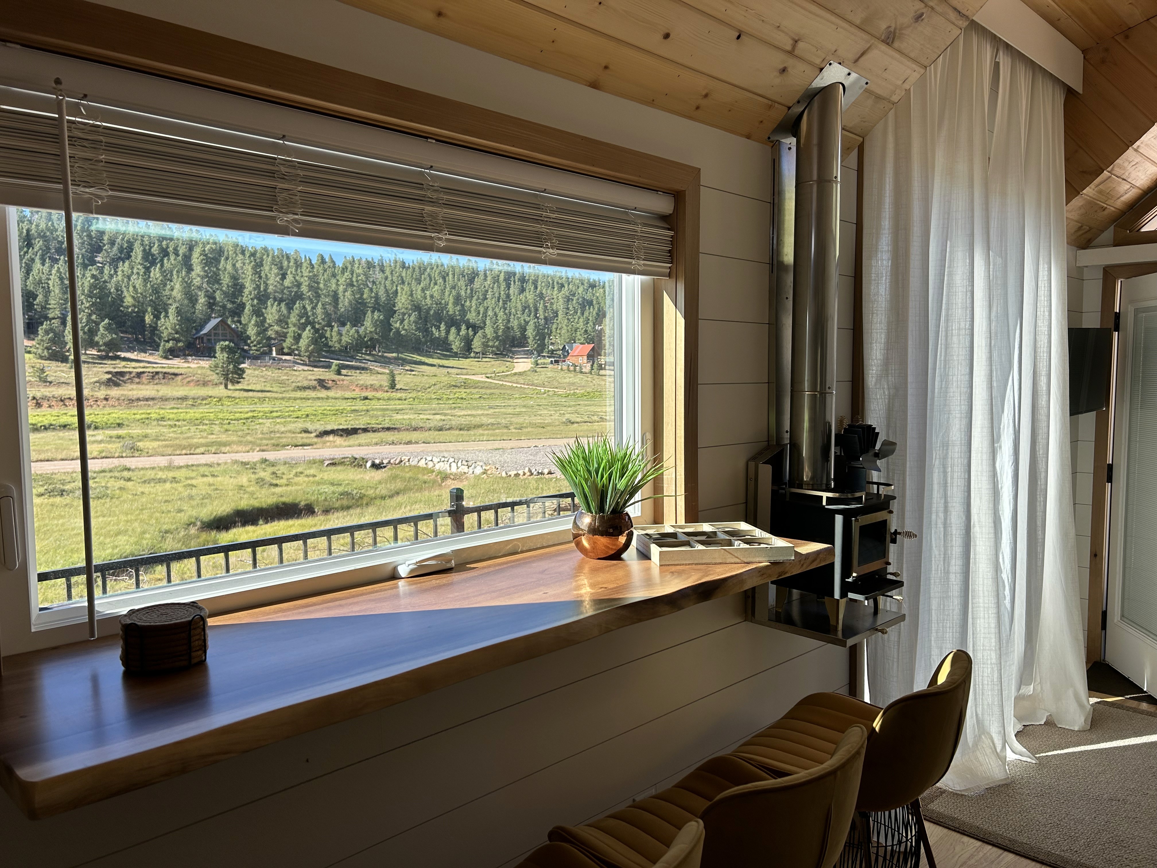 Kitchen sink in front of large gridded window overlooking St. George Utah valley in a Madsen Homes remodel