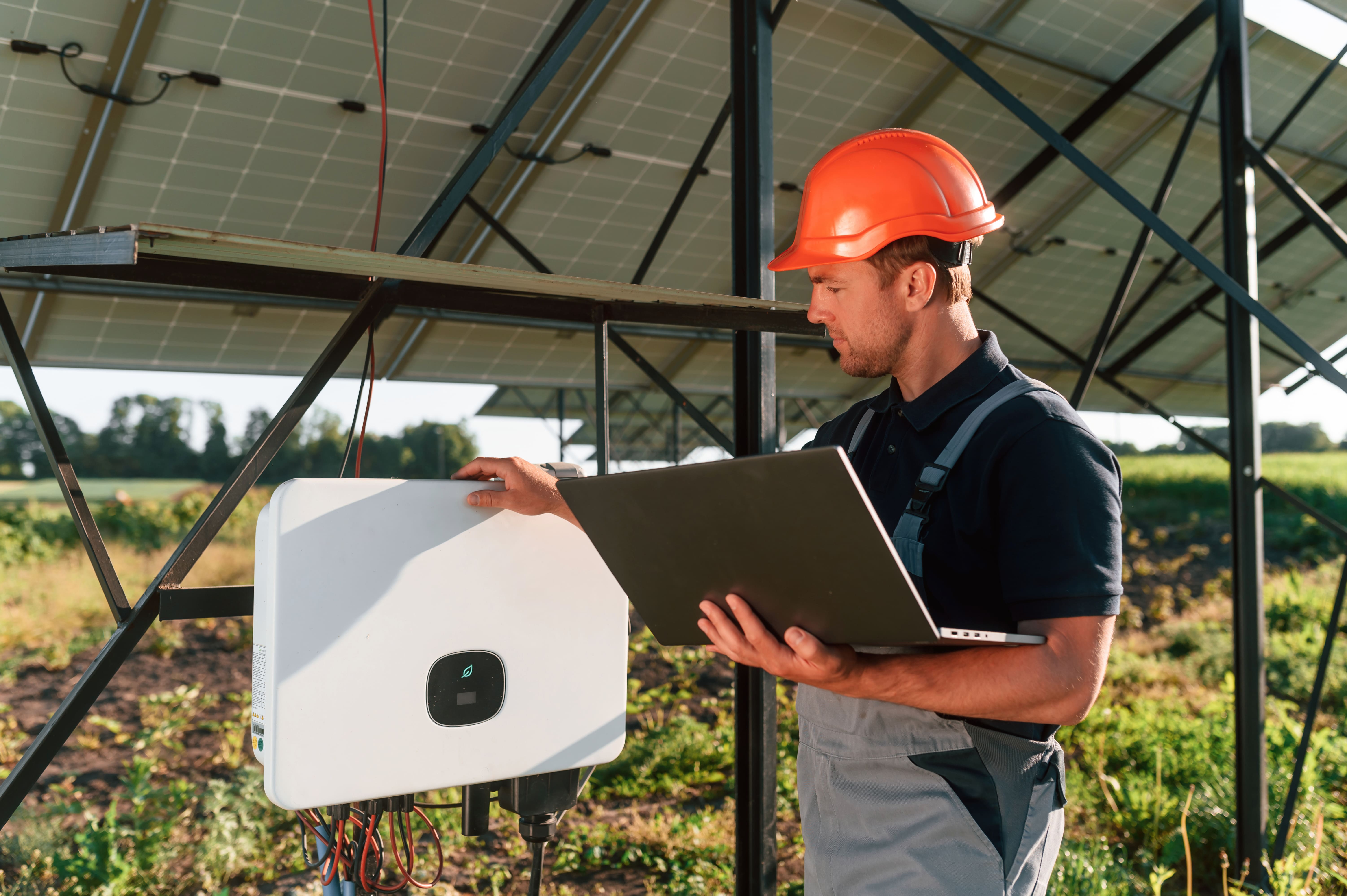 man-with-storage-battery-and-photovoltaic-panels