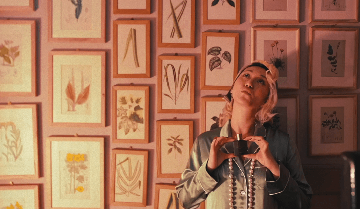 Woman hugging Shiba Inu dog in front of white fence