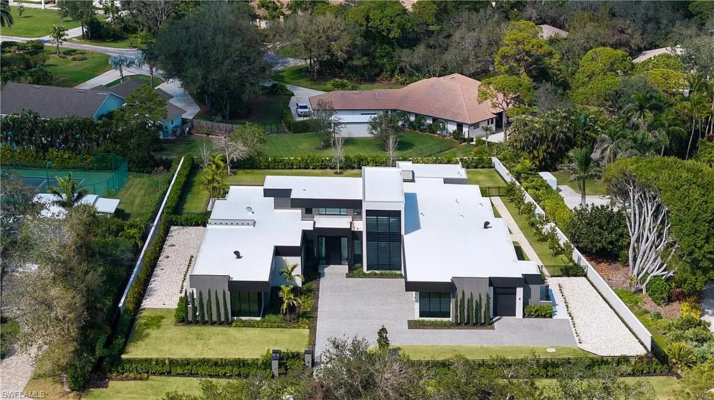 Drone view of the estate showing the expansive 1.12-acre lot in Pine Ridge Estates