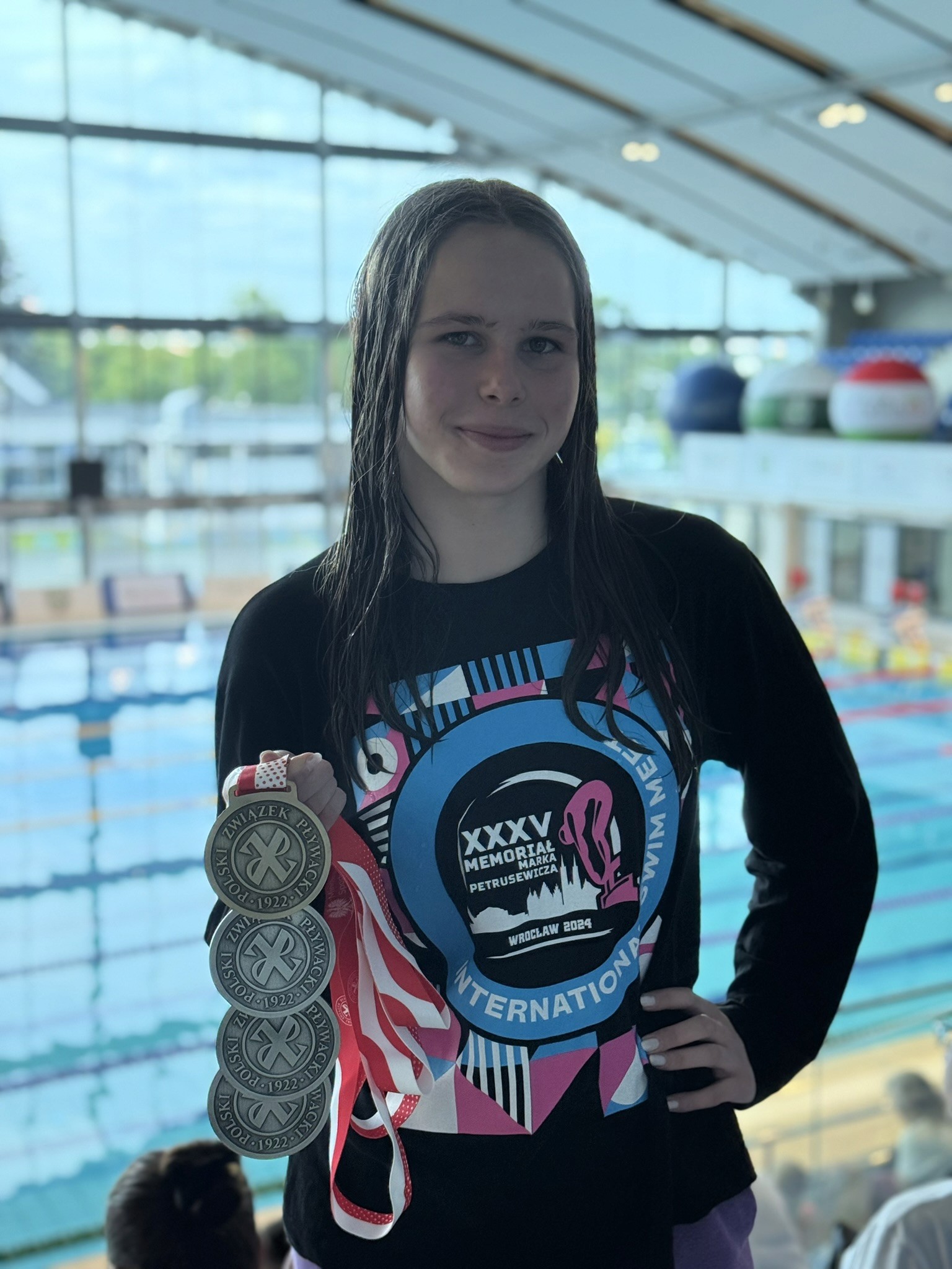 A man stading with Surfboard
