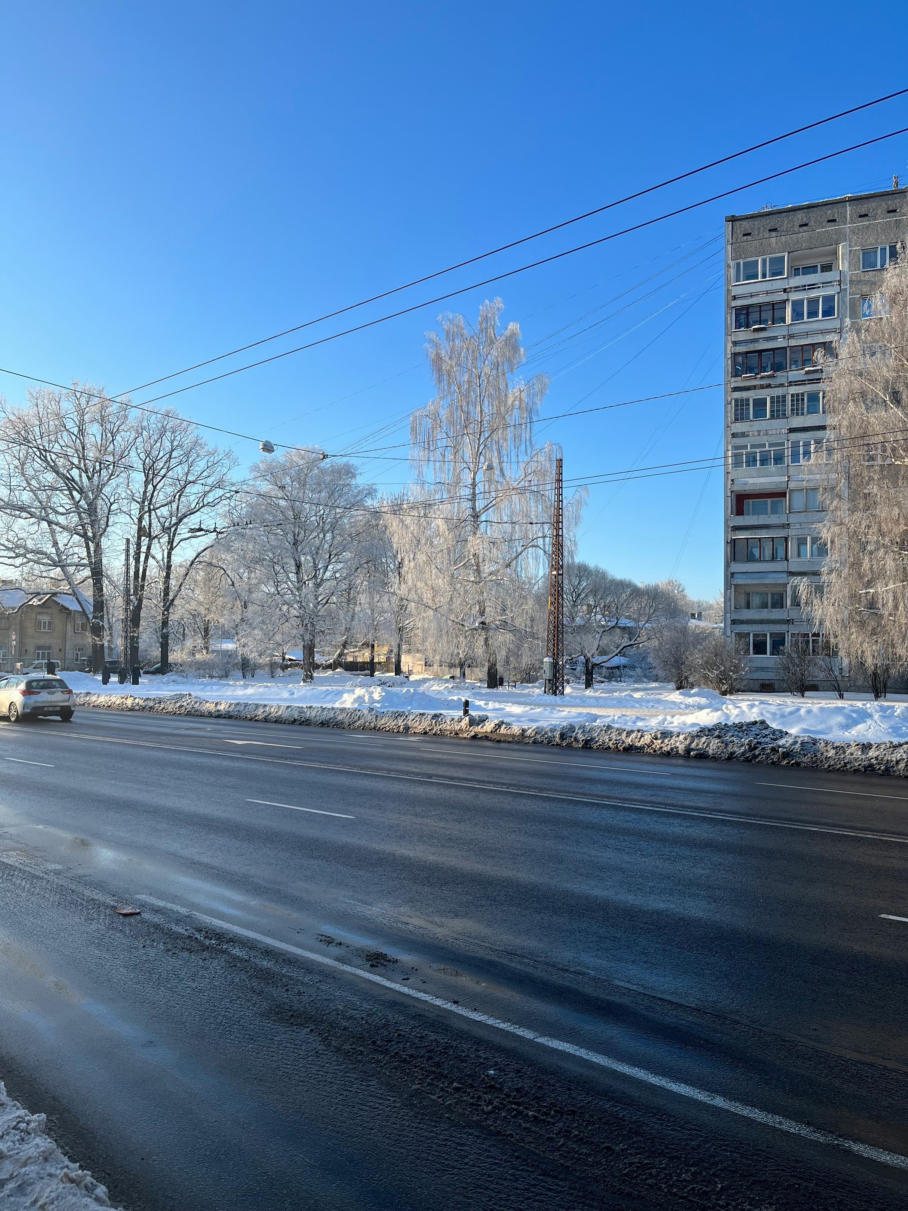 a city street with snow on the ground