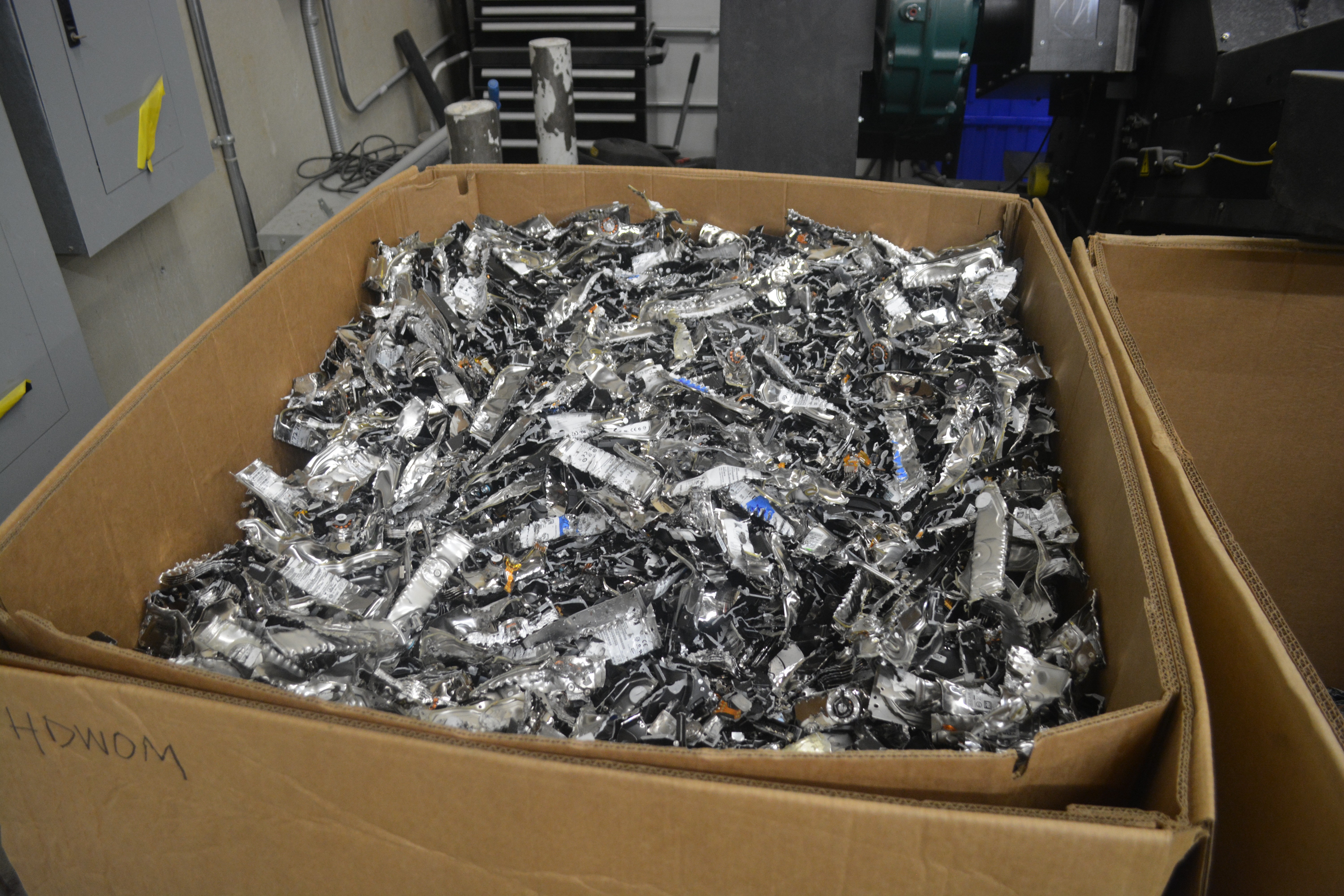 container of secure shredded media and devices