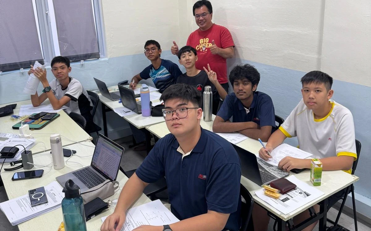 Mr Isaiah Low with his students