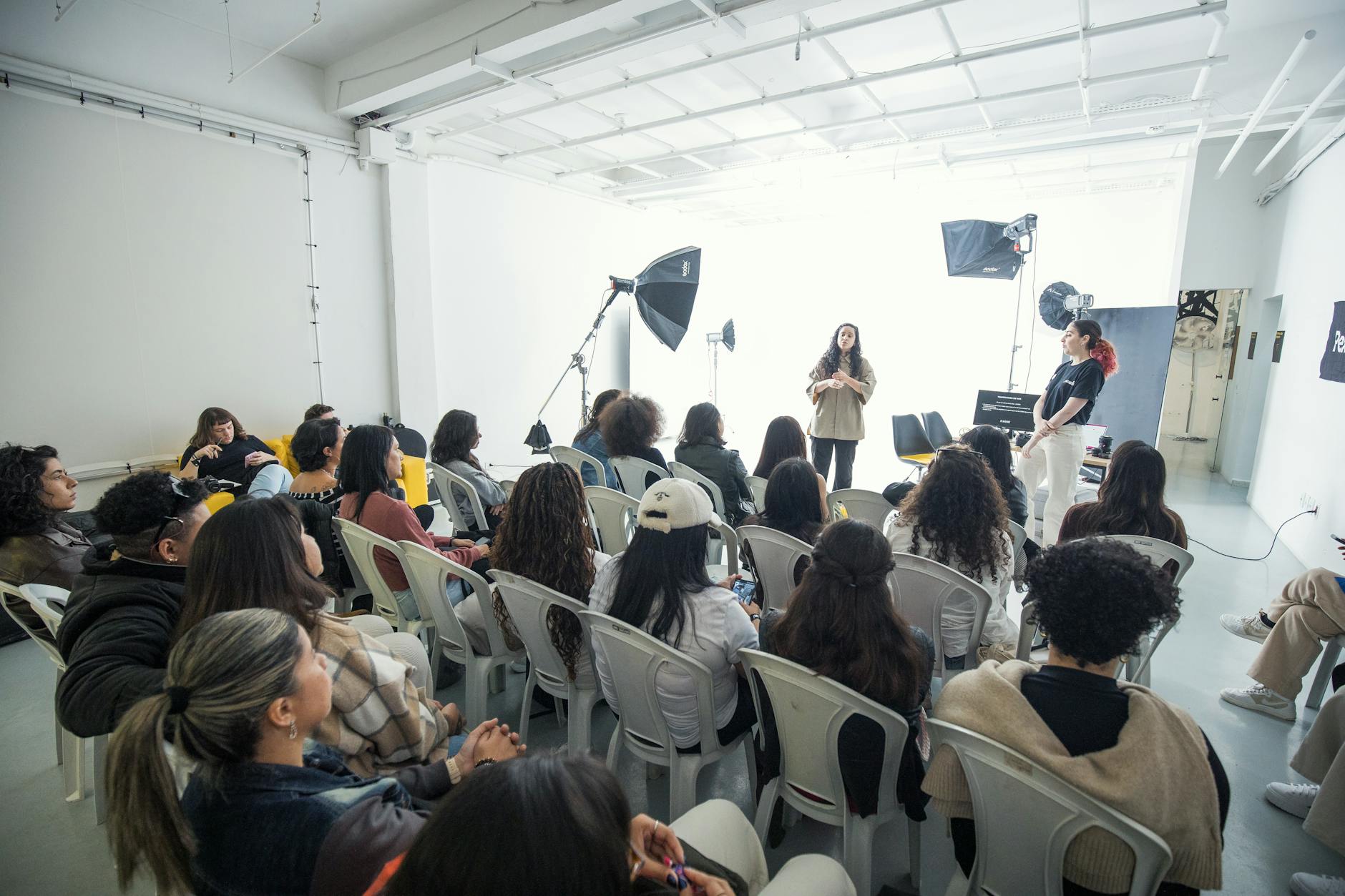 A group of diverse teachers collaborating around a circular table during a professional development workshop.