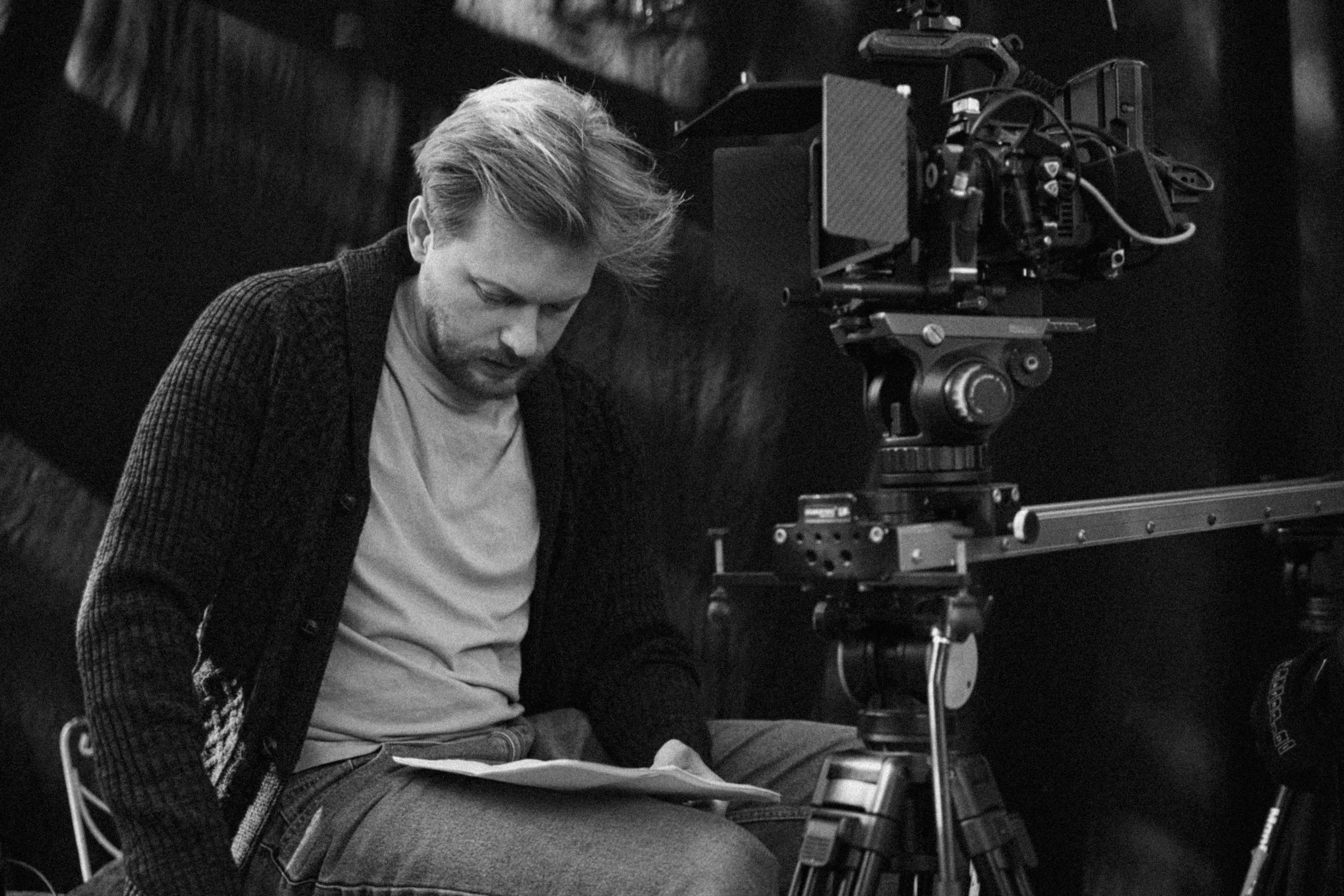 a woman holding a red flower