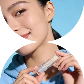 a model in blue hoodie smiling and showing a lipstick in her hands