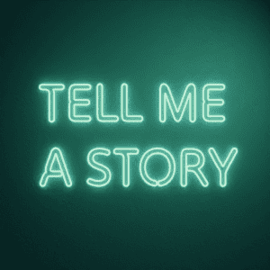 Neon sign saying TELL ME A STORY