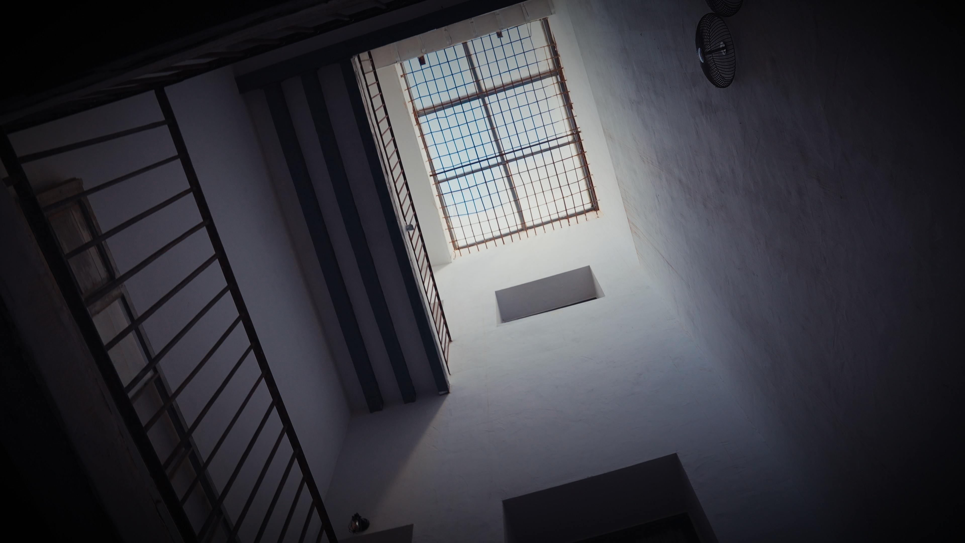 A woman with her eyes closed, wearing a helmet, appears to be in a moment of concentration or relaxation.