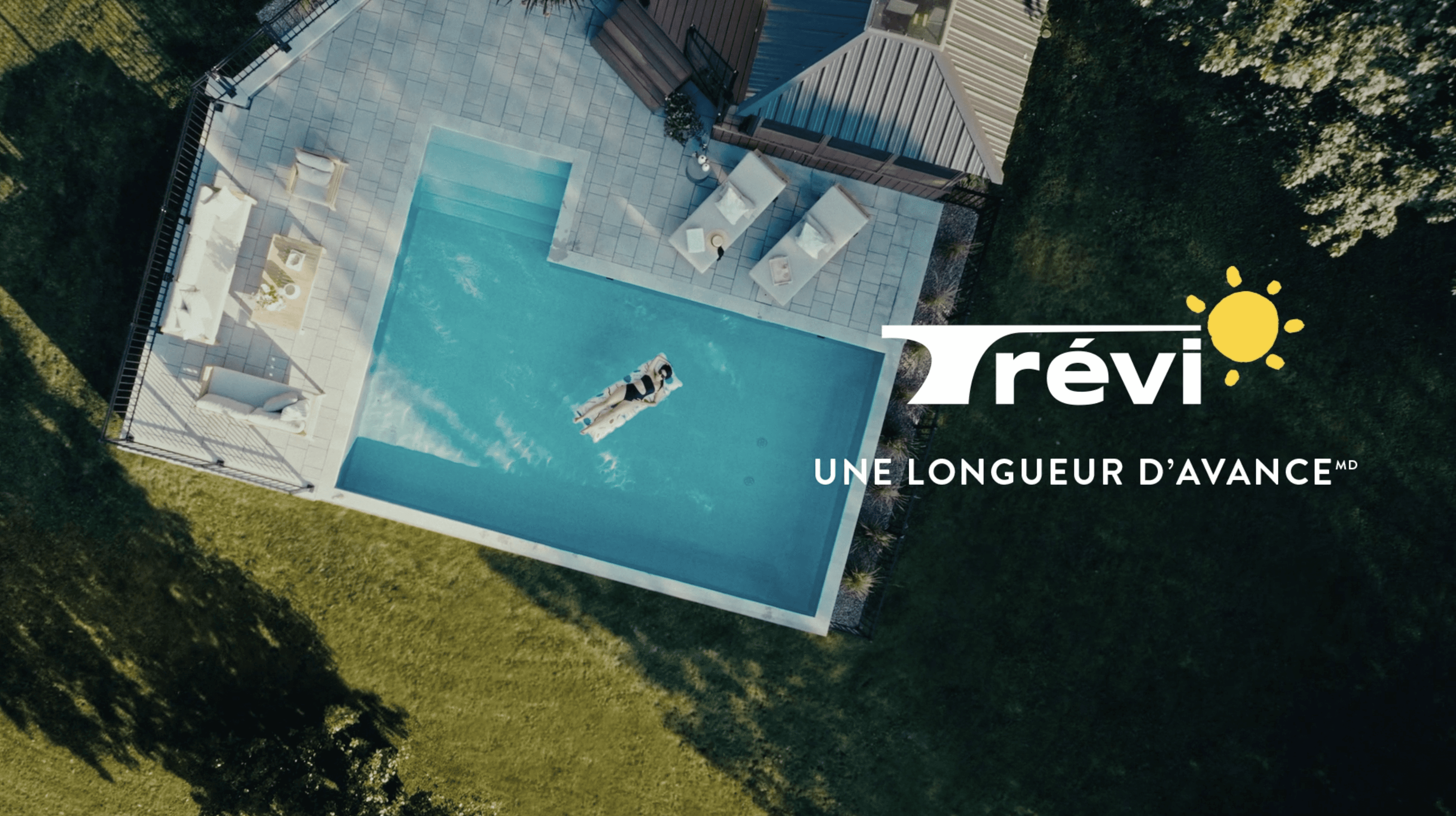 Aerial view of an inground pool in the yard of a house