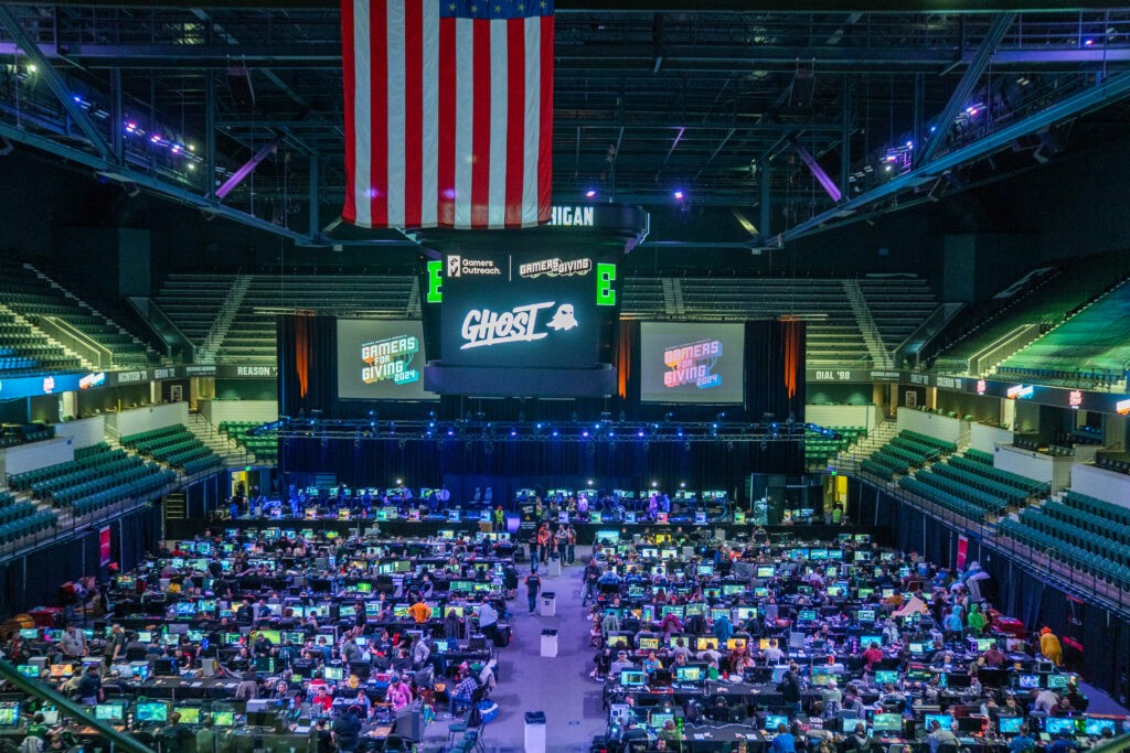 Venue photo showing hundreds of gamers with their LAN setups at Gamers for Giving 2024 in the EMU GameAbove Center