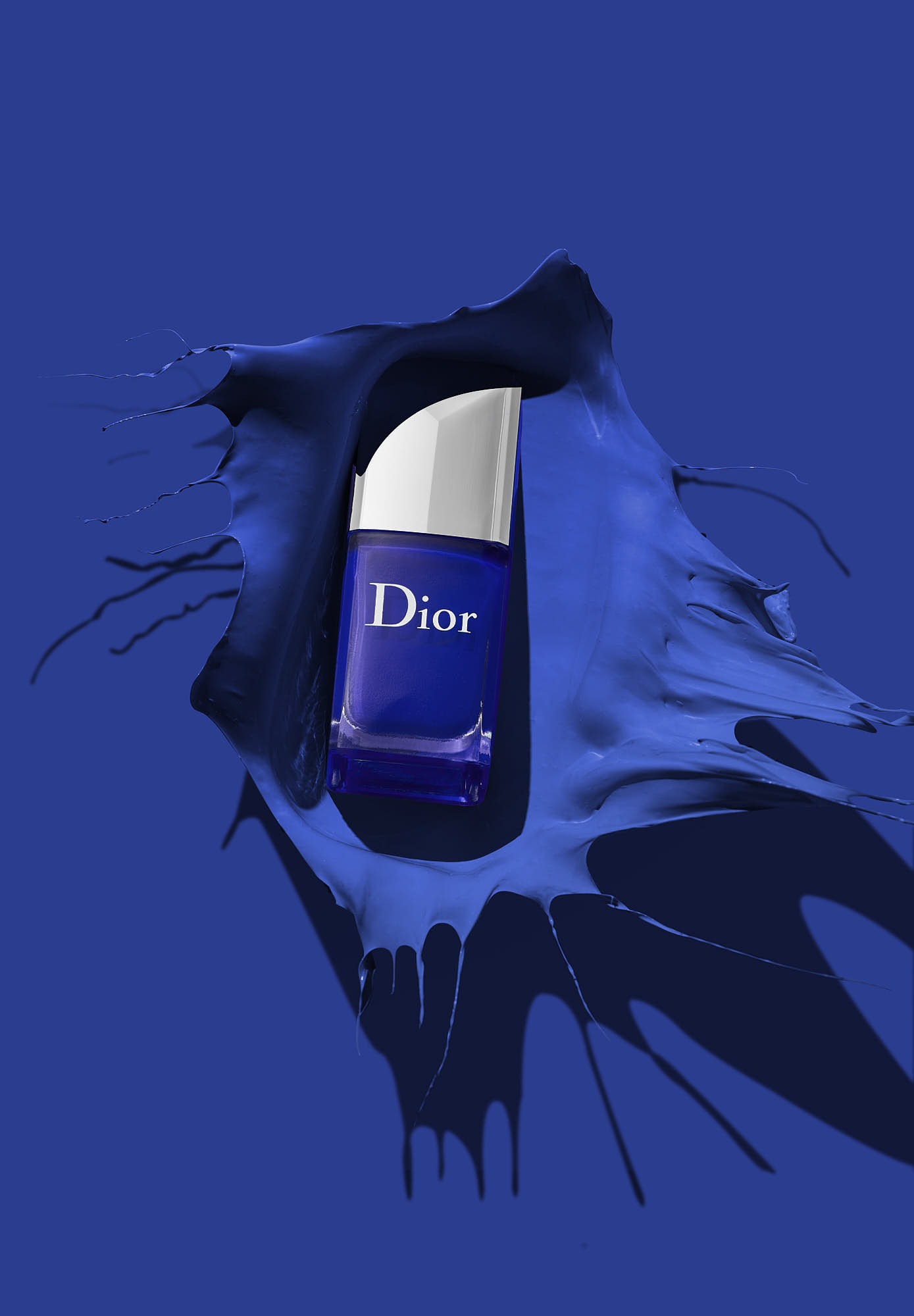 A blue background featuring a stylized depiction of a capsule or pill, partially revealed with splashes of blue.