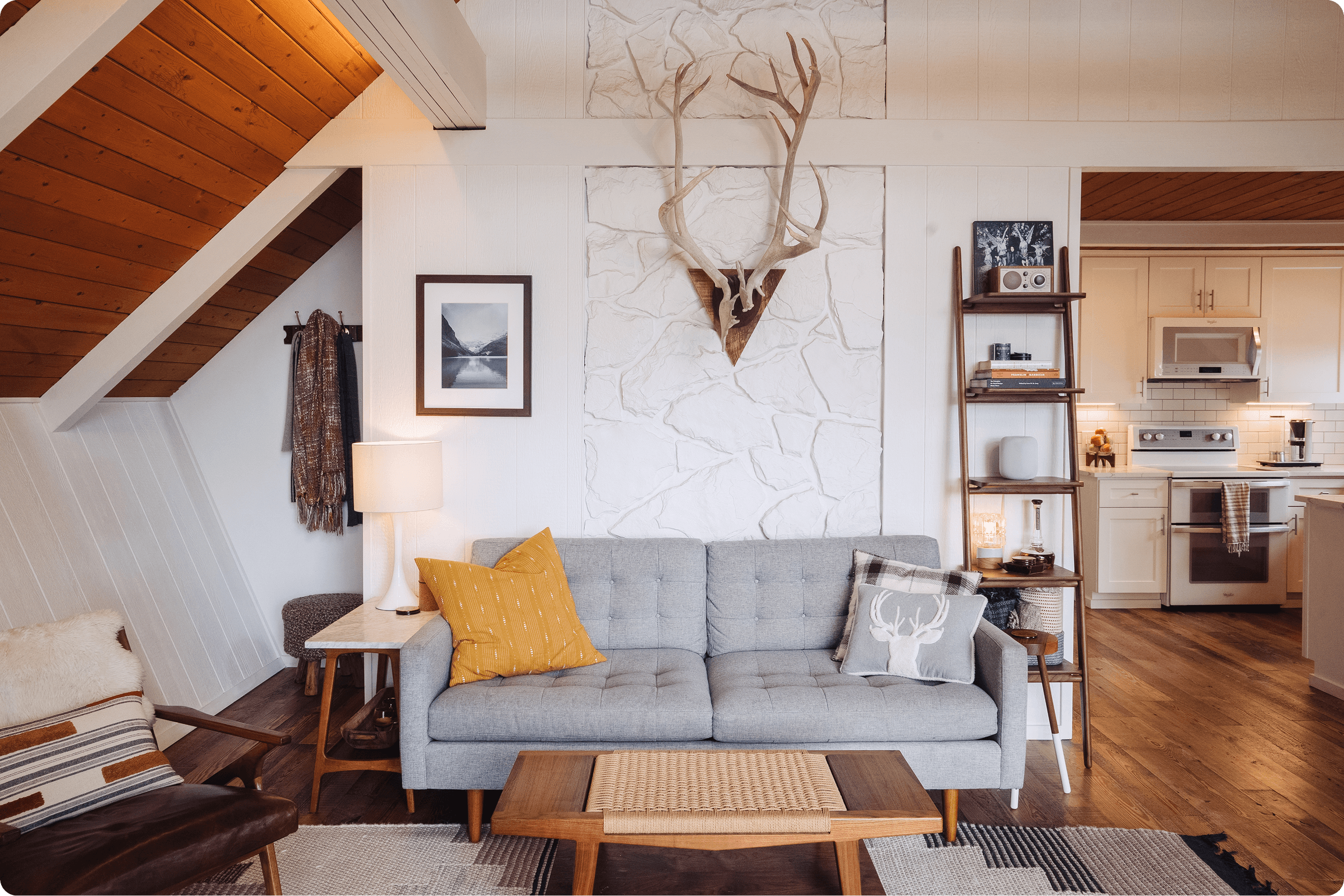 Elegant farmhouse bathroom featuring white marble countertops, vessel sink, chrome sconces, and white shiplap walls