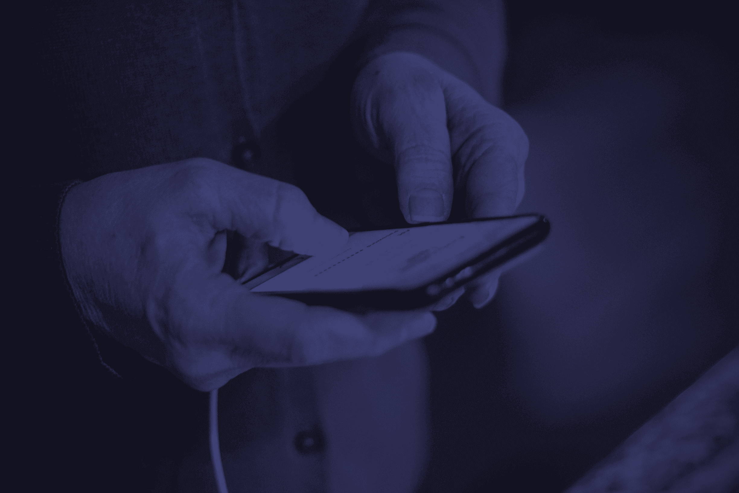 Man considering bidding on an item using his phone