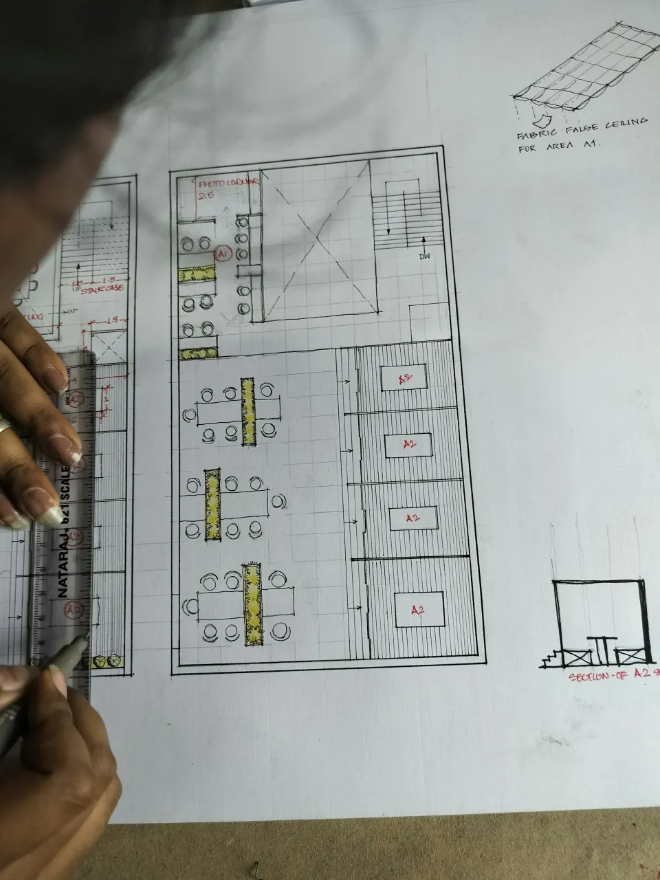Architect drawing a floor plan by hand