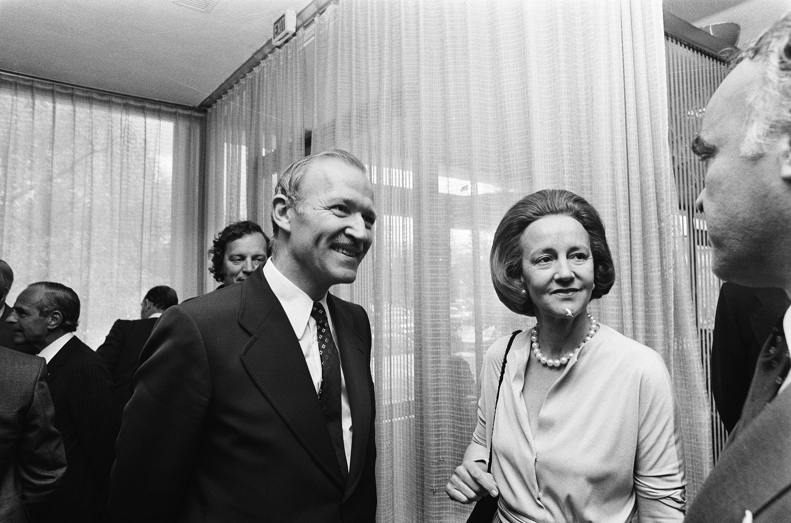 Black-and-white photo of Katharine Graham in a crowd of people.
