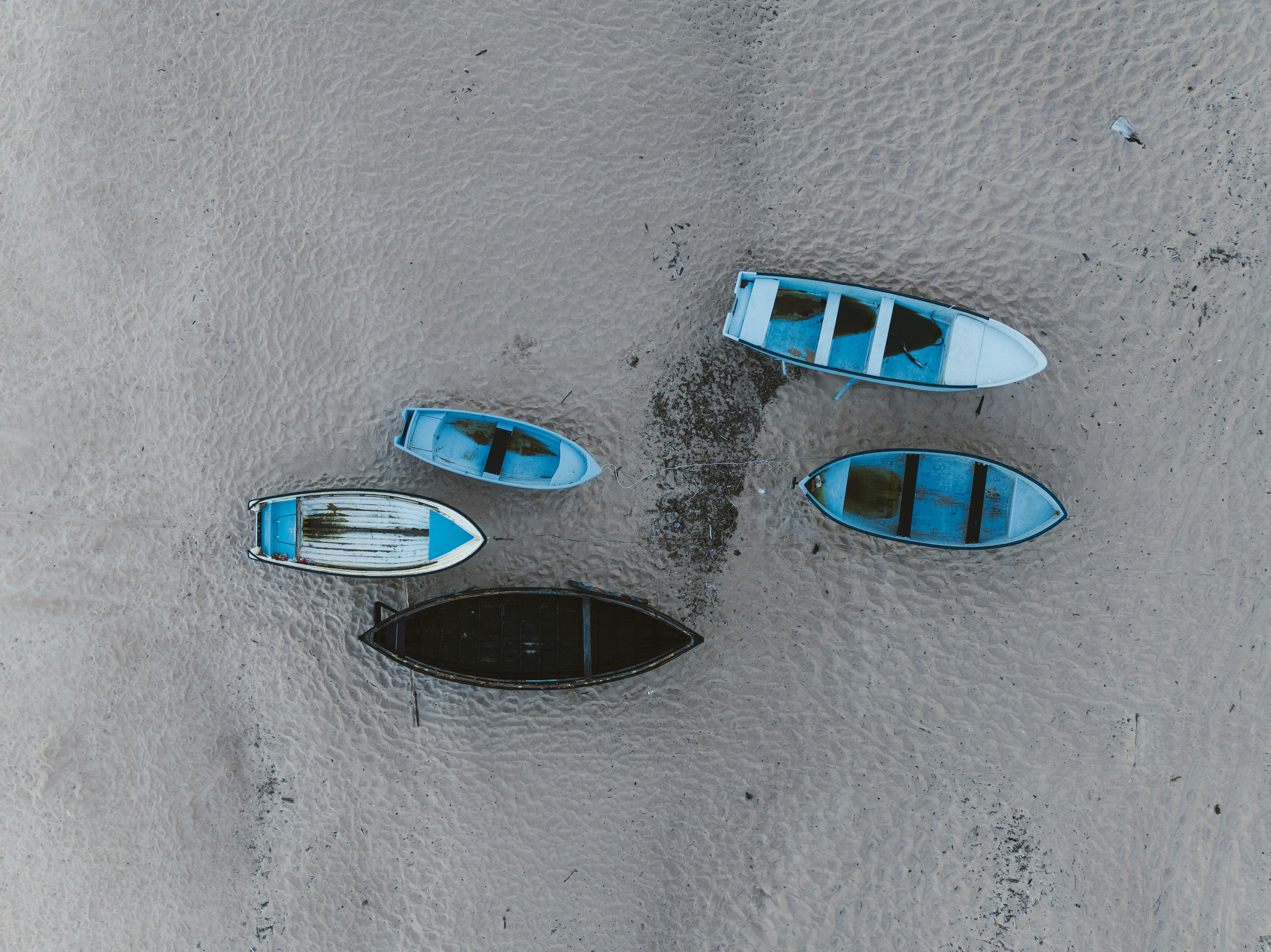 Small boats on sand