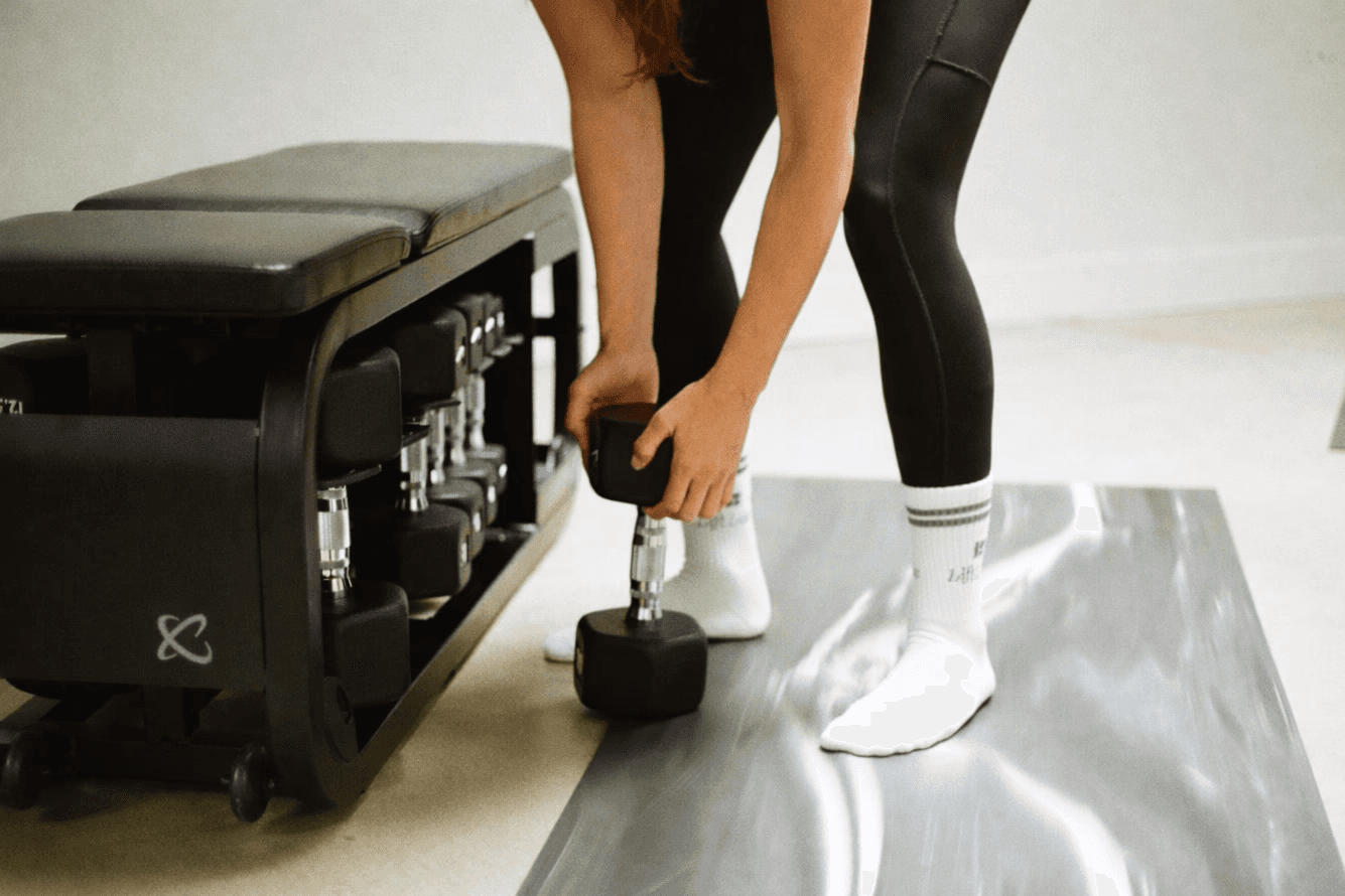 three women kneeling inside building at daytime