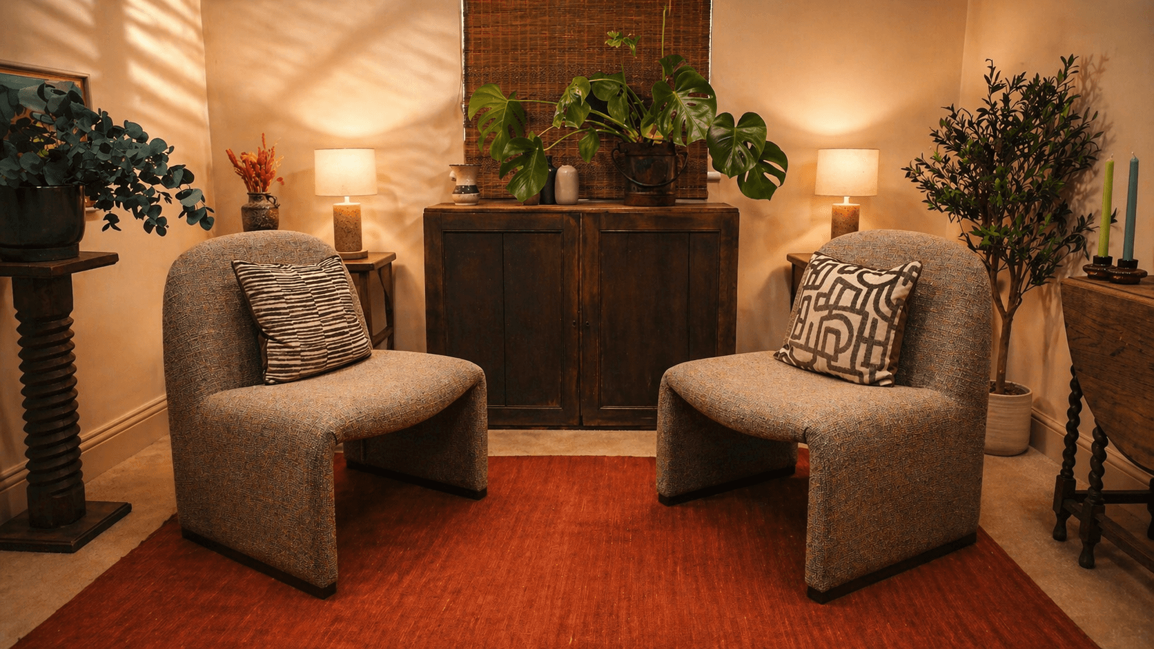 Minimalist entryway with curved walls, pampas grass, and a neutral bench under soft natural light.